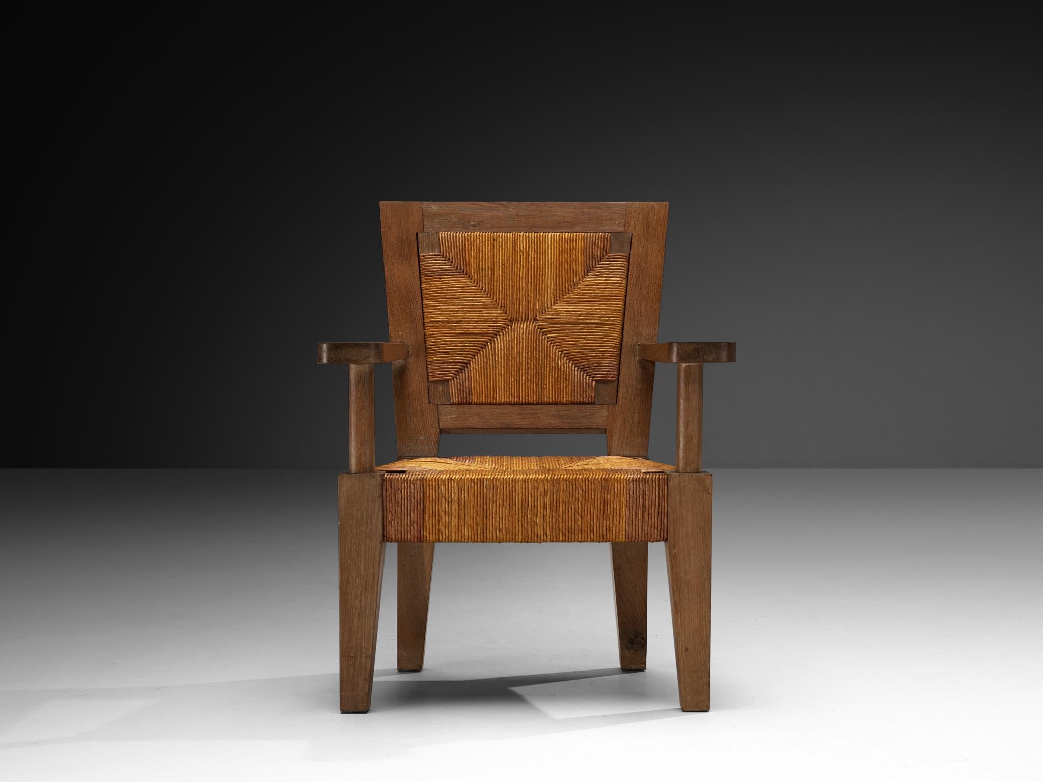 Fauteuils monumentaux français Art Déco en chêne et jonc en vente 1