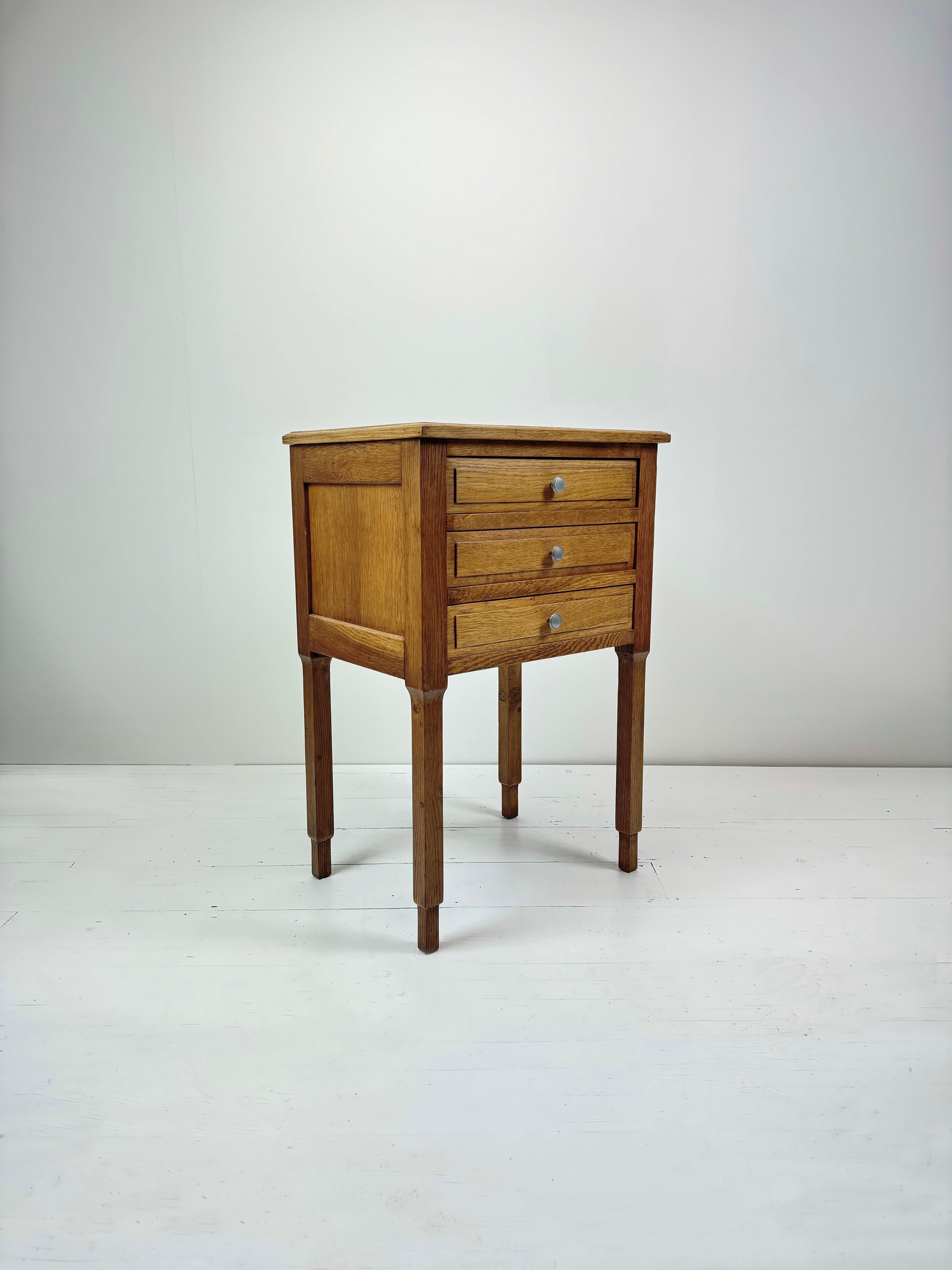 Add a touch of old-world elegance to your bedroom with this exquisite Art Deco, French Oak Parquetry Top, Night Stand, dating back to the 1930's France. The stunning parquetry top showcase the finest craftsmanship of the erain France for Parquetry