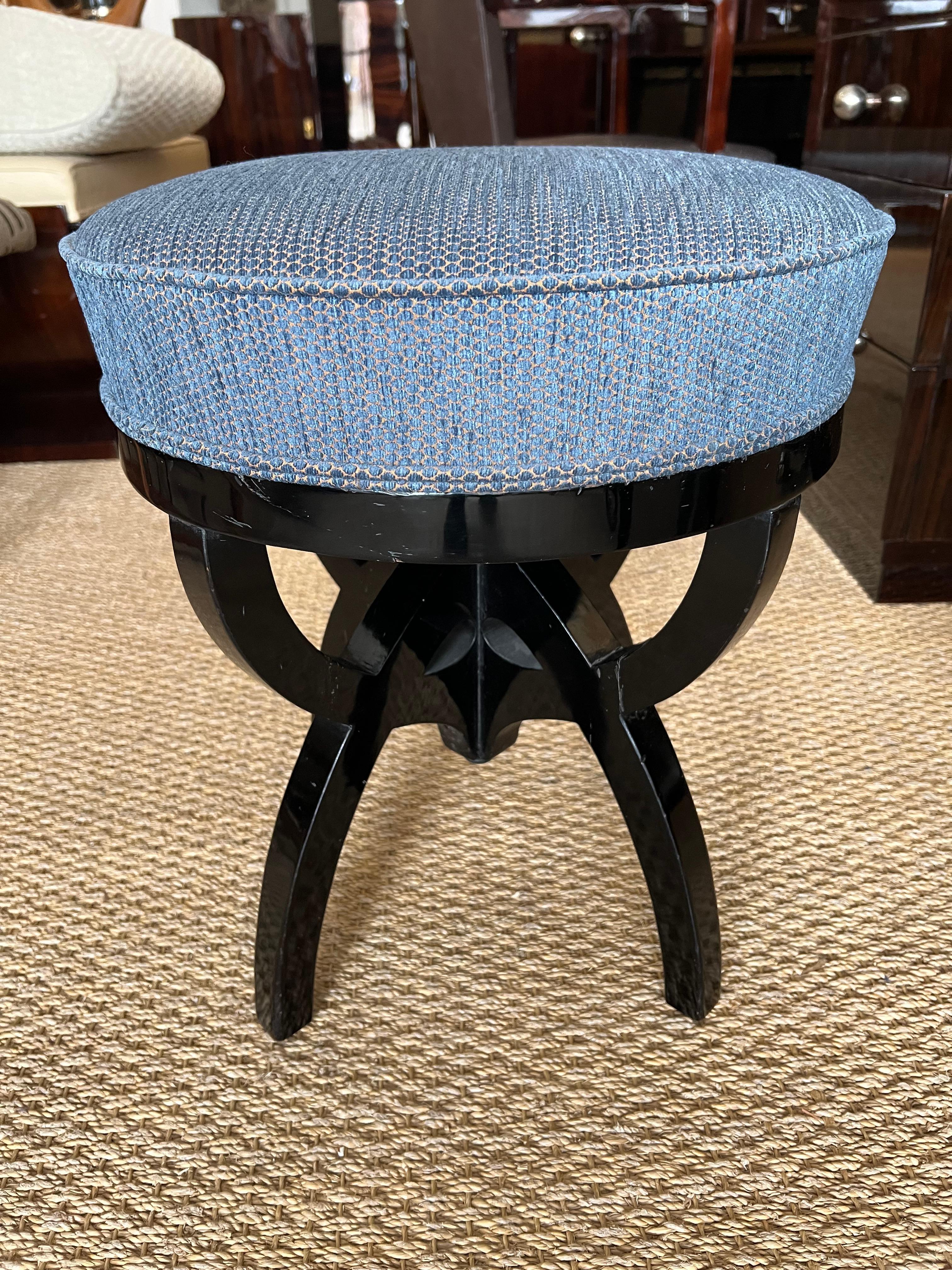 Art Nouveau Austrian ottoman is made out of ebonized walnut wood. Re-upholstered in blue fabric. It has 4 curved legs that are connected  with each other on top. 
Austria c. 1910-1920s
18