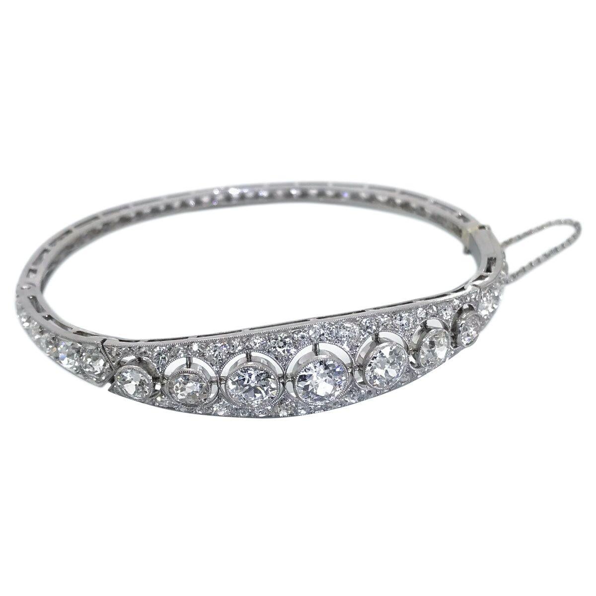 This is an amazing bangle, you won't see too many of these, a rare one-of-a-kind piece of jewellery that will be handed down to future generations. A gorgeous French platinum bangle with 7 old European cut diamonds highlighted across the top
