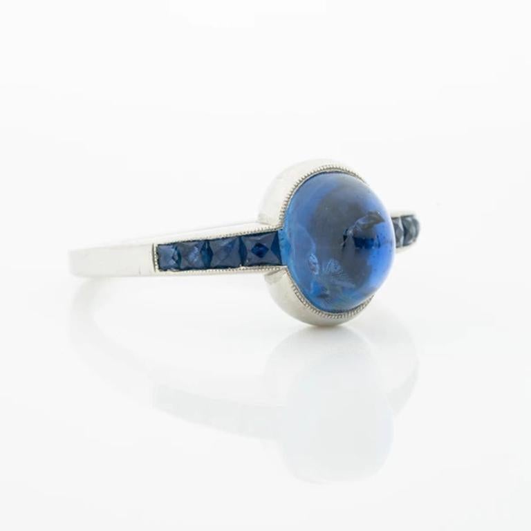 Art Deco Platinum and French Cut Sapphires featuring a 1.30 Carat Natural Cabochon Sugarloaf Sapphire c.1925. 

As the Art Deco craze swept the fashion world of the 1920s, so too did the rise of costume jewelry. Brightly colored birthstones cut into
