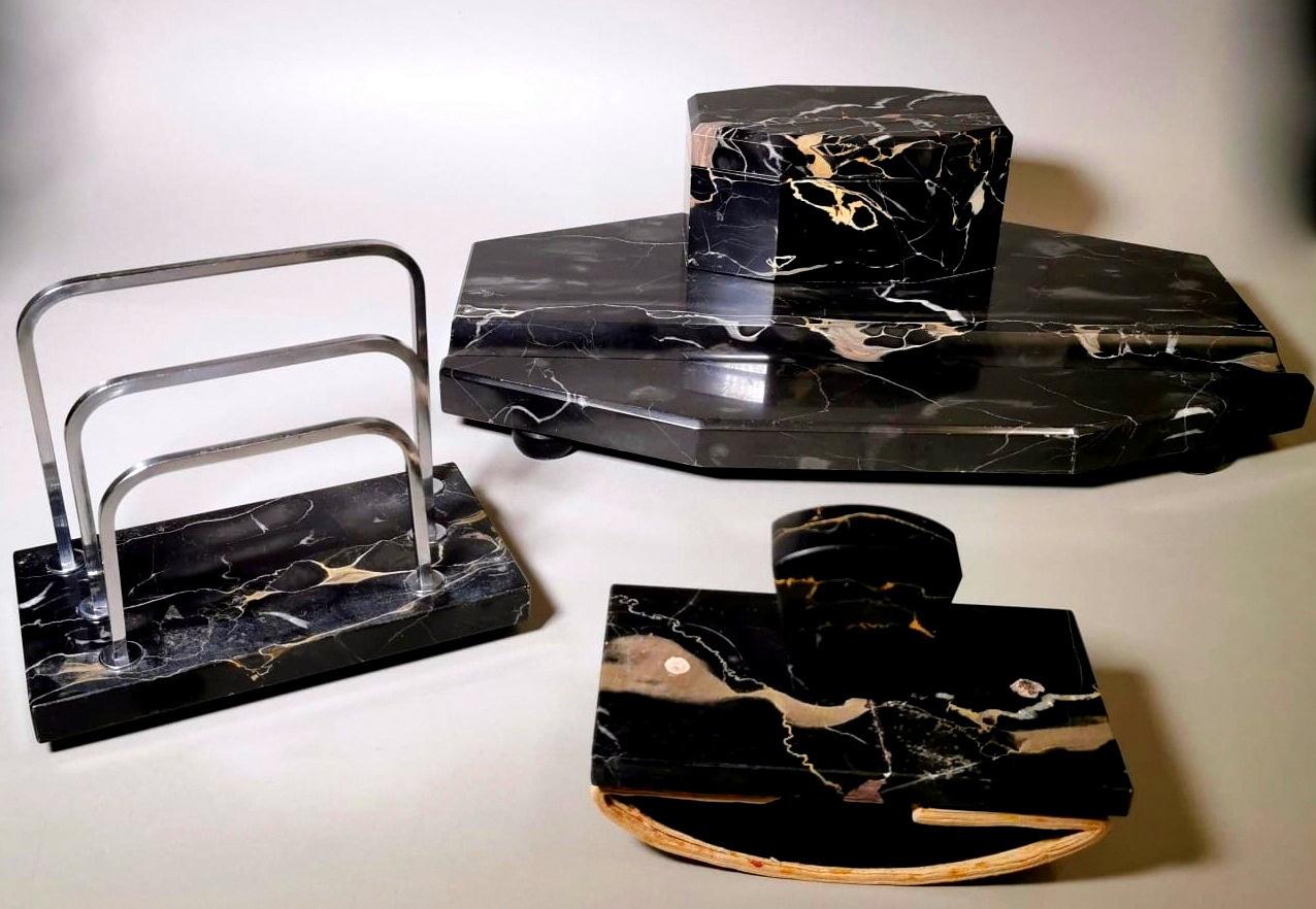 We kindly suggest you read the whole description, because with it we try to give you detailed technical and historical information to guarantee the authenticity of our objects.
Original and important desk set in polished black marble; the massive