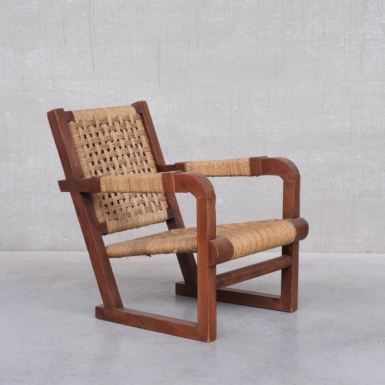 A rope work wooden armchair attributed to Francis Jourdain. 

France, c1930s. 

Woven cord. 

Good condition generally, some knocks and wear to the wood commensurate with age. 

Location: Belgium Gallery. 

Dimensions: 62 W x 77 D x 38