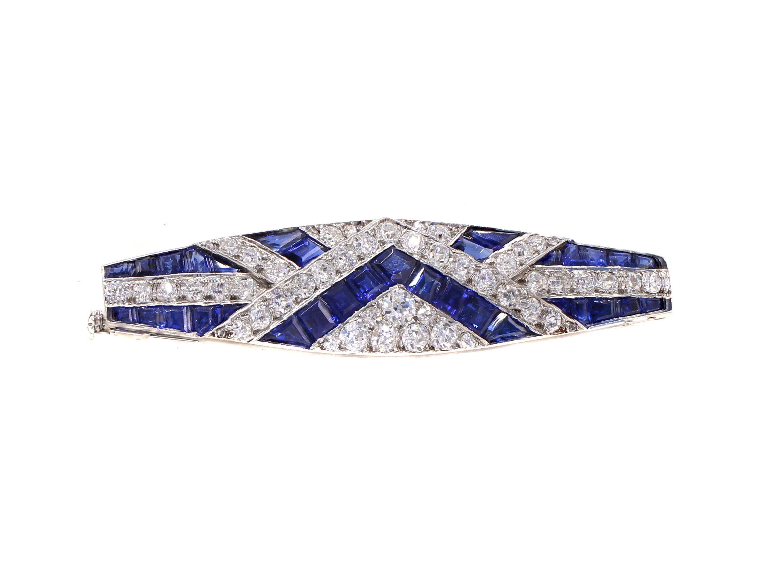 French Art Deco brooch form ca 1930, beautifully designed and masterfully handcrafted in platinum The strong geometric design was the signature of the Art Deco period which is presented in this brooch with magnificent royal blue sapphires perfectly