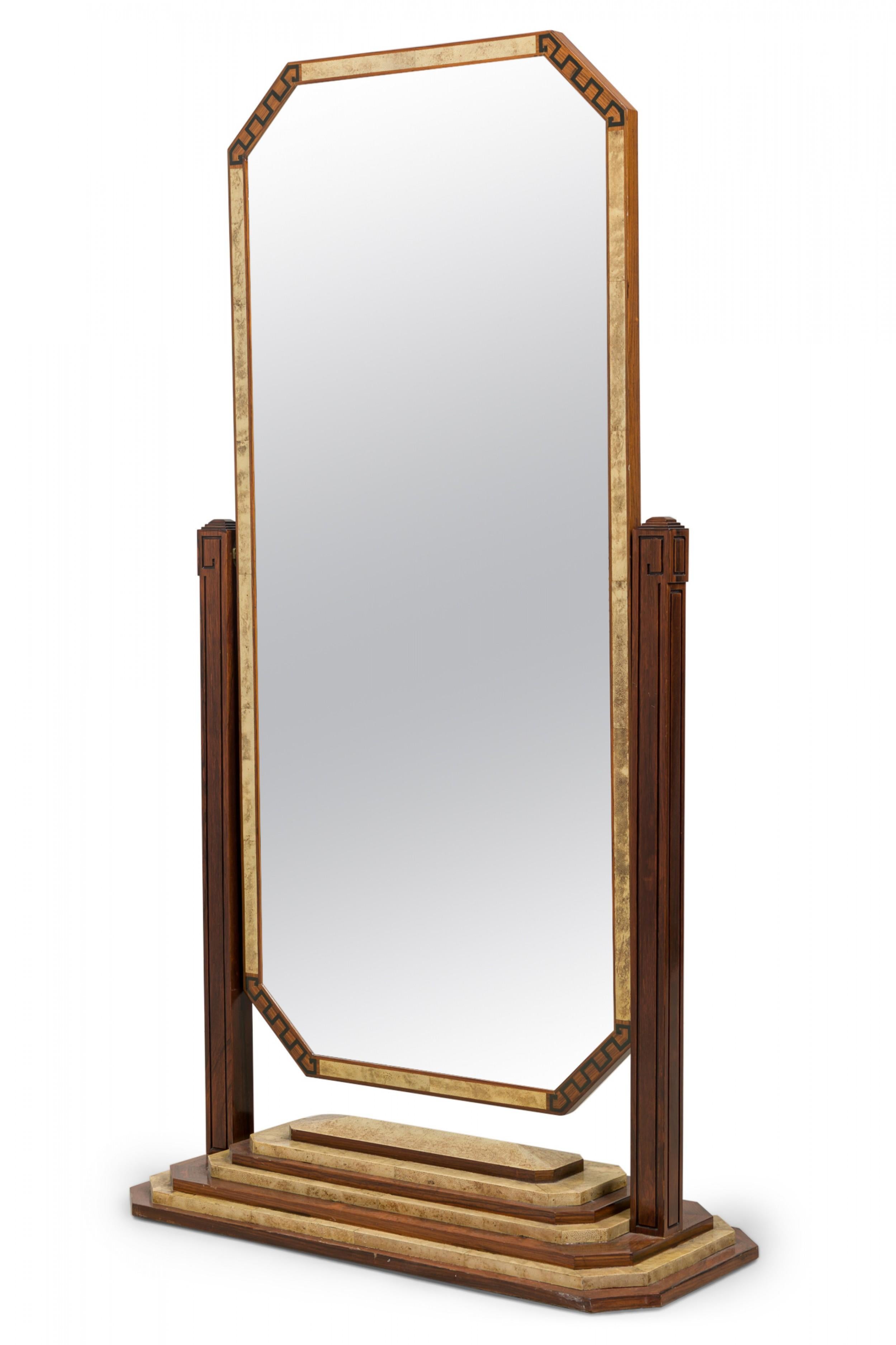 French Art Deco (1930s) shagreen and rosewood octagonal mirror with inlaid keyfret borders and shagreen panels along the frame, hinged to pivot by two parallel supports, resting on stepped wood and shagreen base.