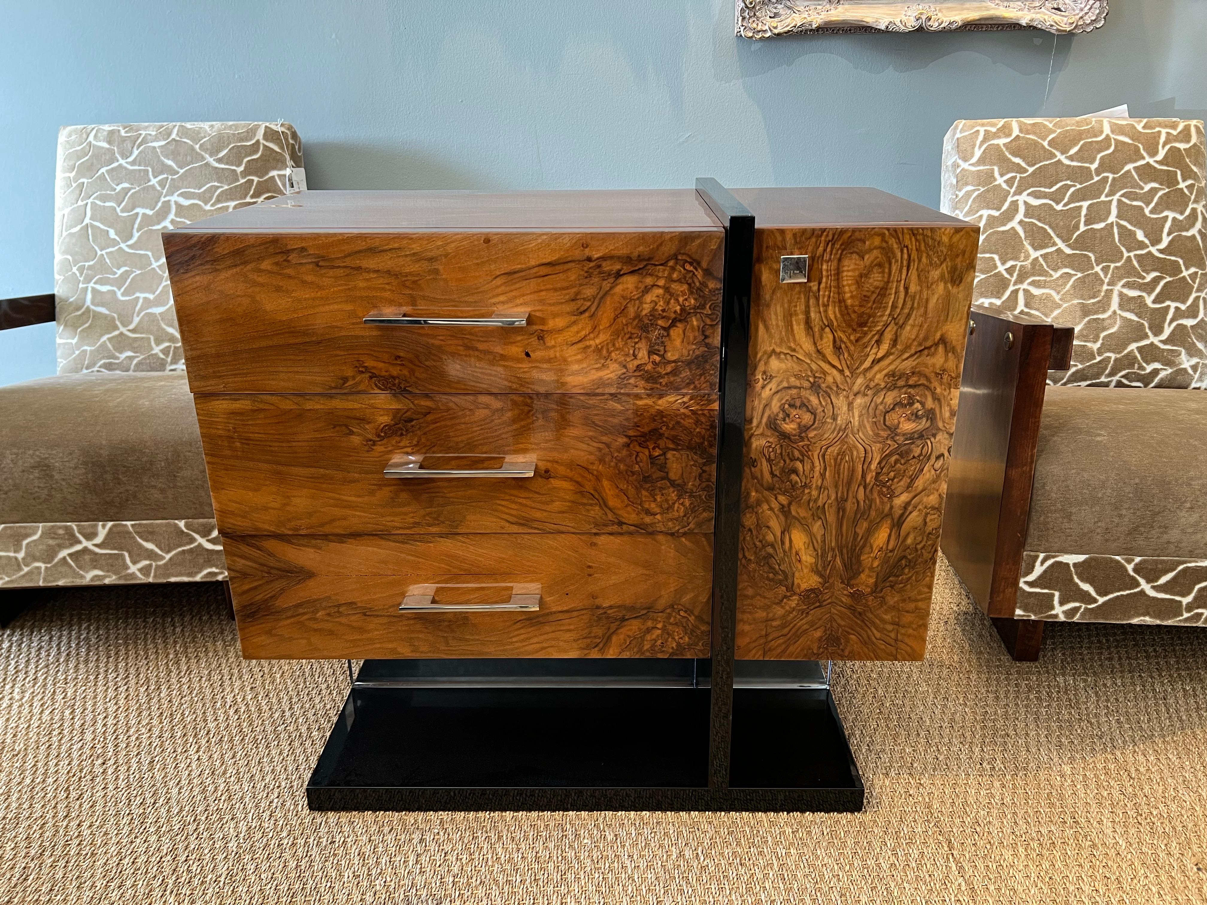 Side table is made out of high quality burl walnut wool. It has ebonized rectangular flat base. Table has 3 horizontal drawers and one vertical drawer with “sphere shape” handles.

Condition is excellent. 

France, circa 1930s

 Measure: 34.5” W x