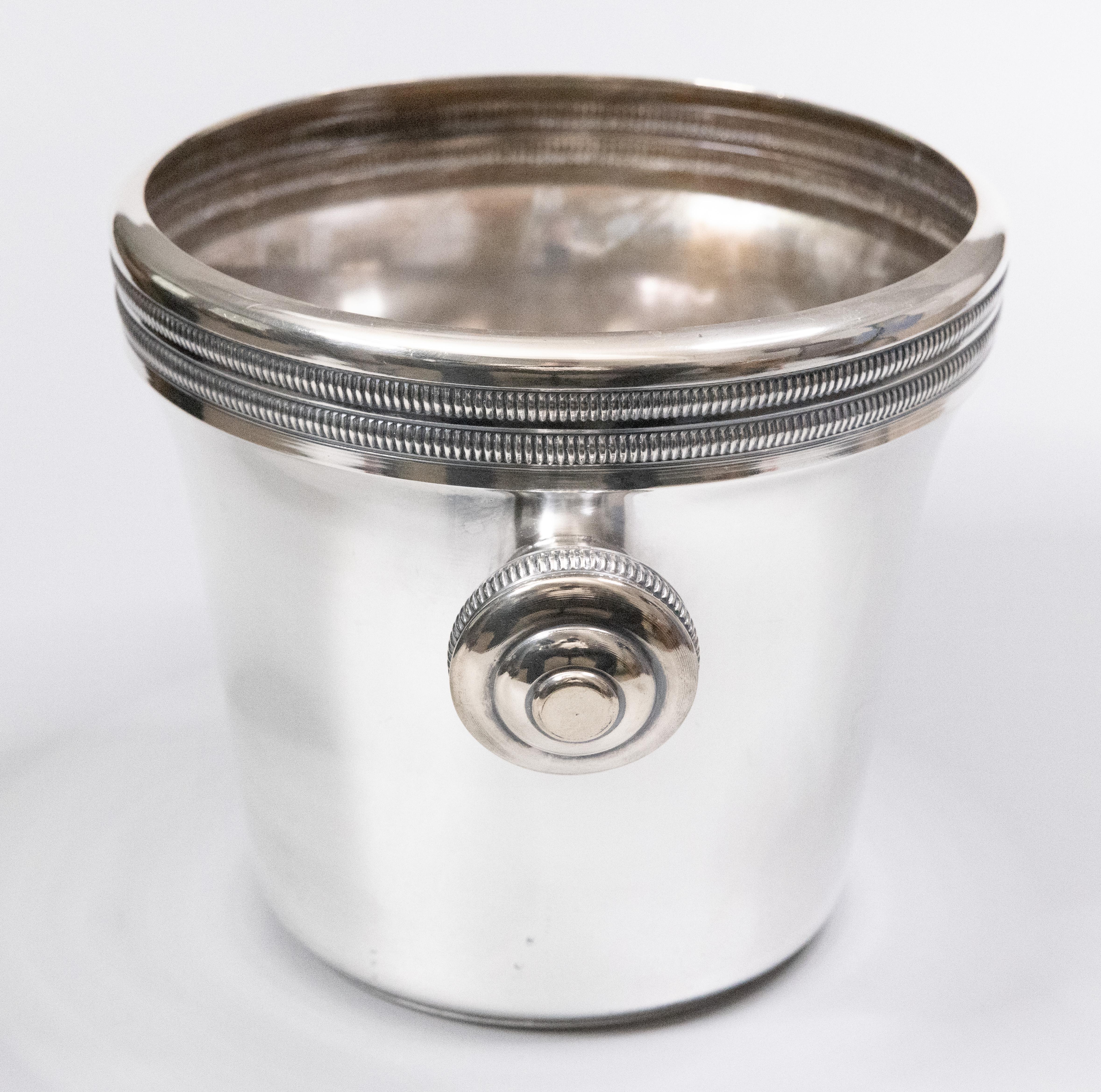 A fabulous early 20th-century French Art Deco silver plated champagne ice bucket or wine cooler with round knob handles and gadrooned trim. Maker's mark on reverse. This fine quality ice bucket is solid and heavy with a sleek design, ideal for the