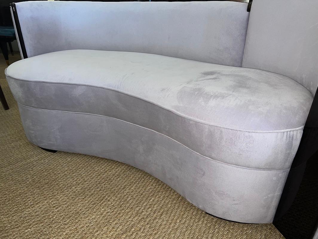 French Art Deco sofa

Great Art Deco sofa has “kidney” shape body. The back is slightly curved. Sofa is newly re-upholstered in a light purple velvet fabric. Outer edge of the back has dark walnut trimming, which creates strong juxtaposition of