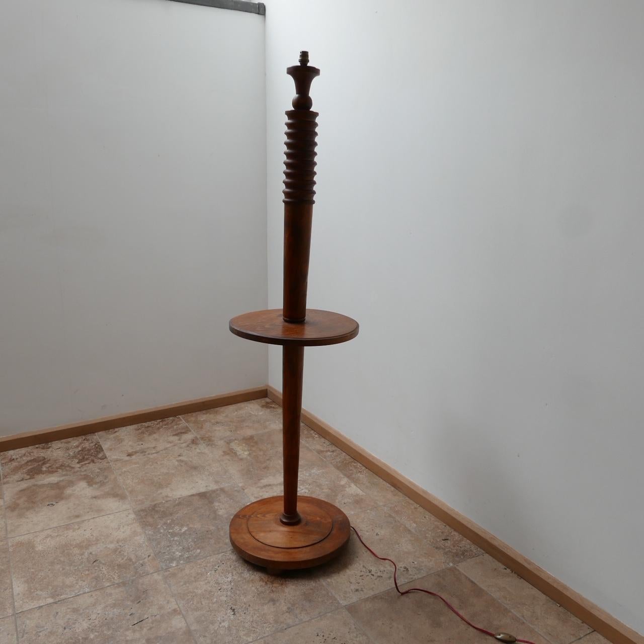 An Art Deco bordering on midcentury floor lamp.

Wildly stylish, half height tabletop, ribbed top detailing.

Since re-wired and PAT tested.

France, circa 1930s.

Dimensions: 150 height x 40 diameter in cm.