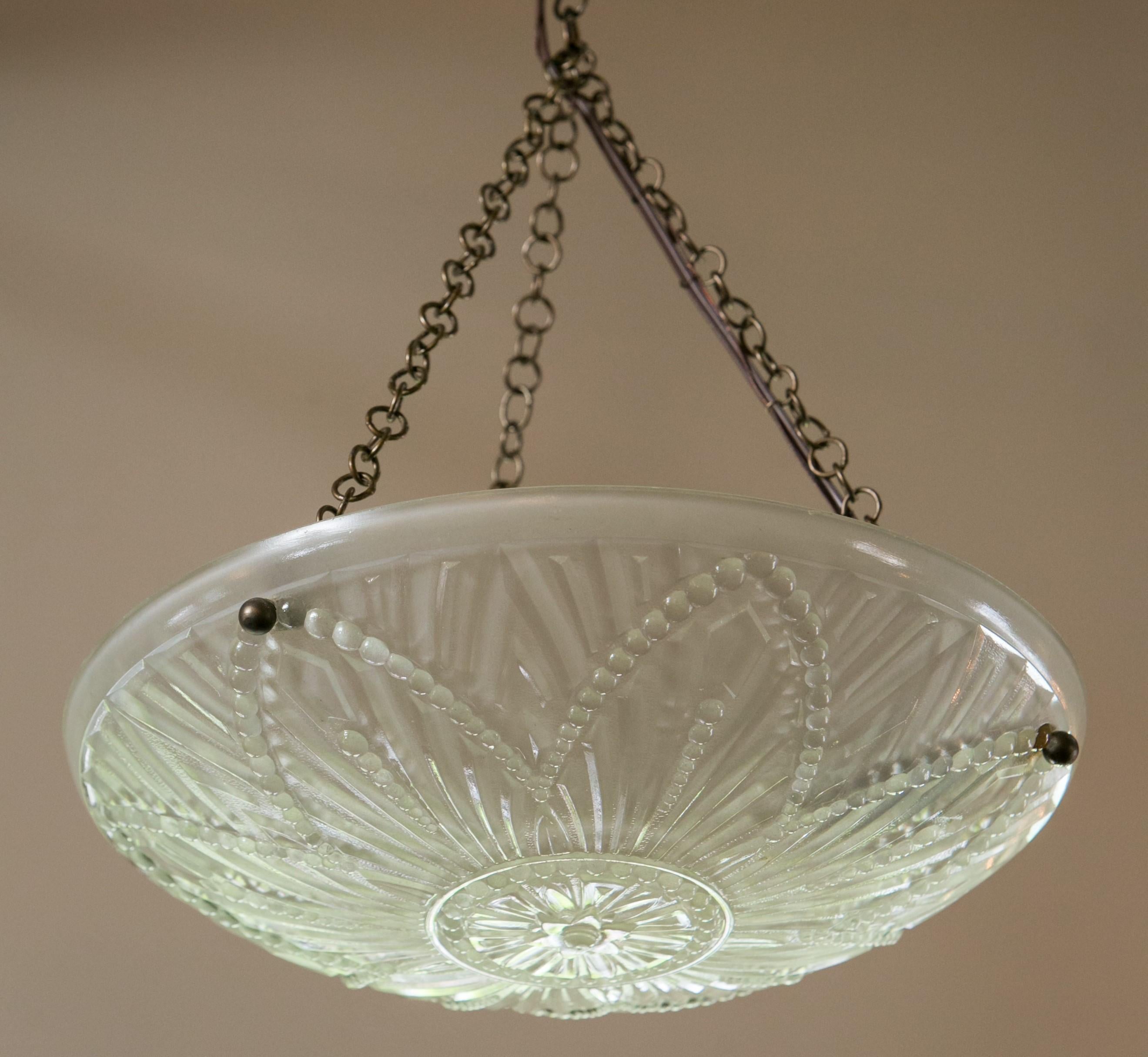 Art Deco frosted glass chandelier or pendant from France. The sweet light has been newly wired for use within the USA. It is all original except for the canopy. It has a flower and dot design. The light could have its chain shortened a bit to become