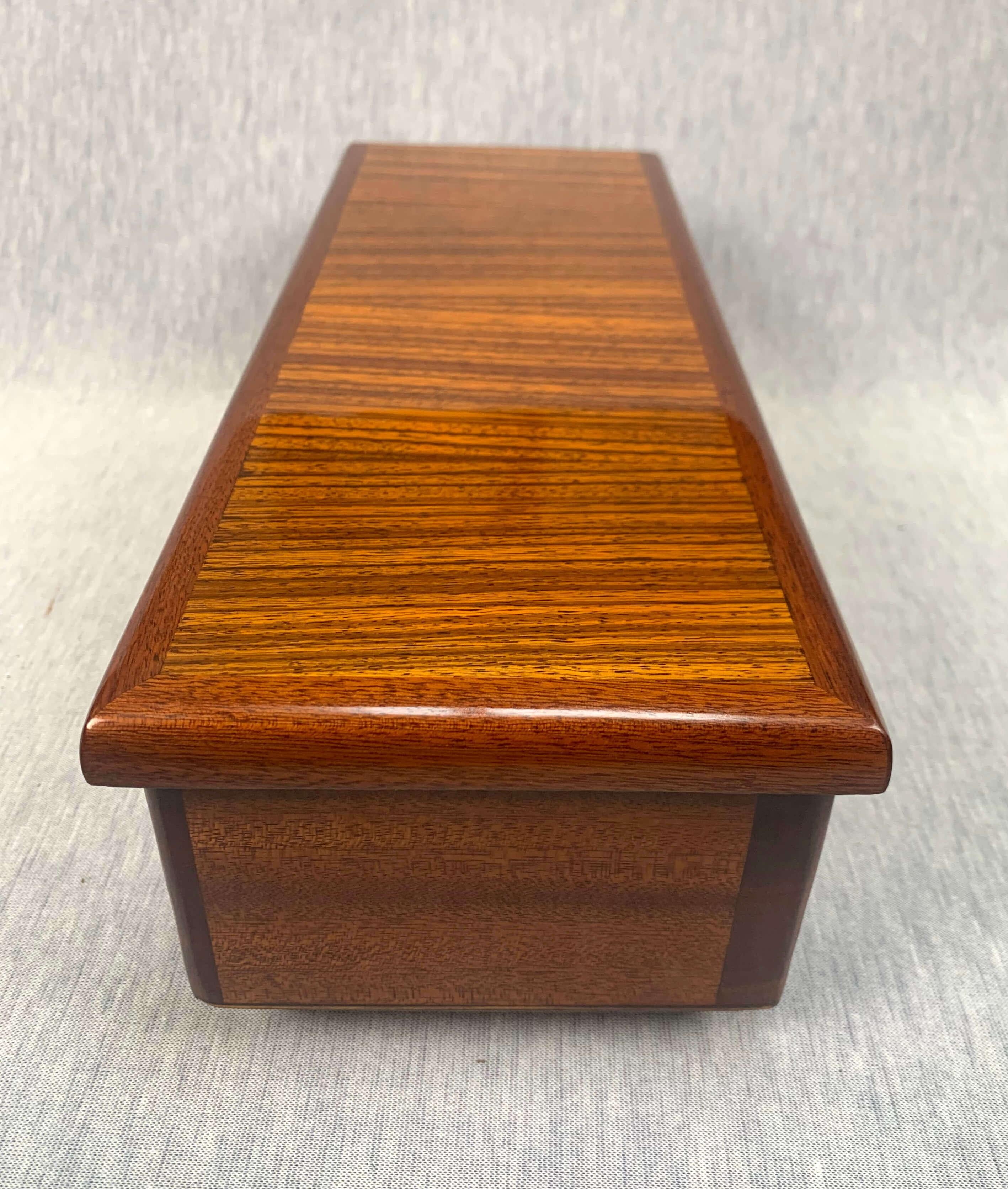 Art Deco game box, rosewood and walnut, France, circa 1930

Long Art Deco game box made of rosewood and walnut.
Inside three compartments for games and green felt.

Dimensions: H 11.5, W 39.5, D 15 cm.