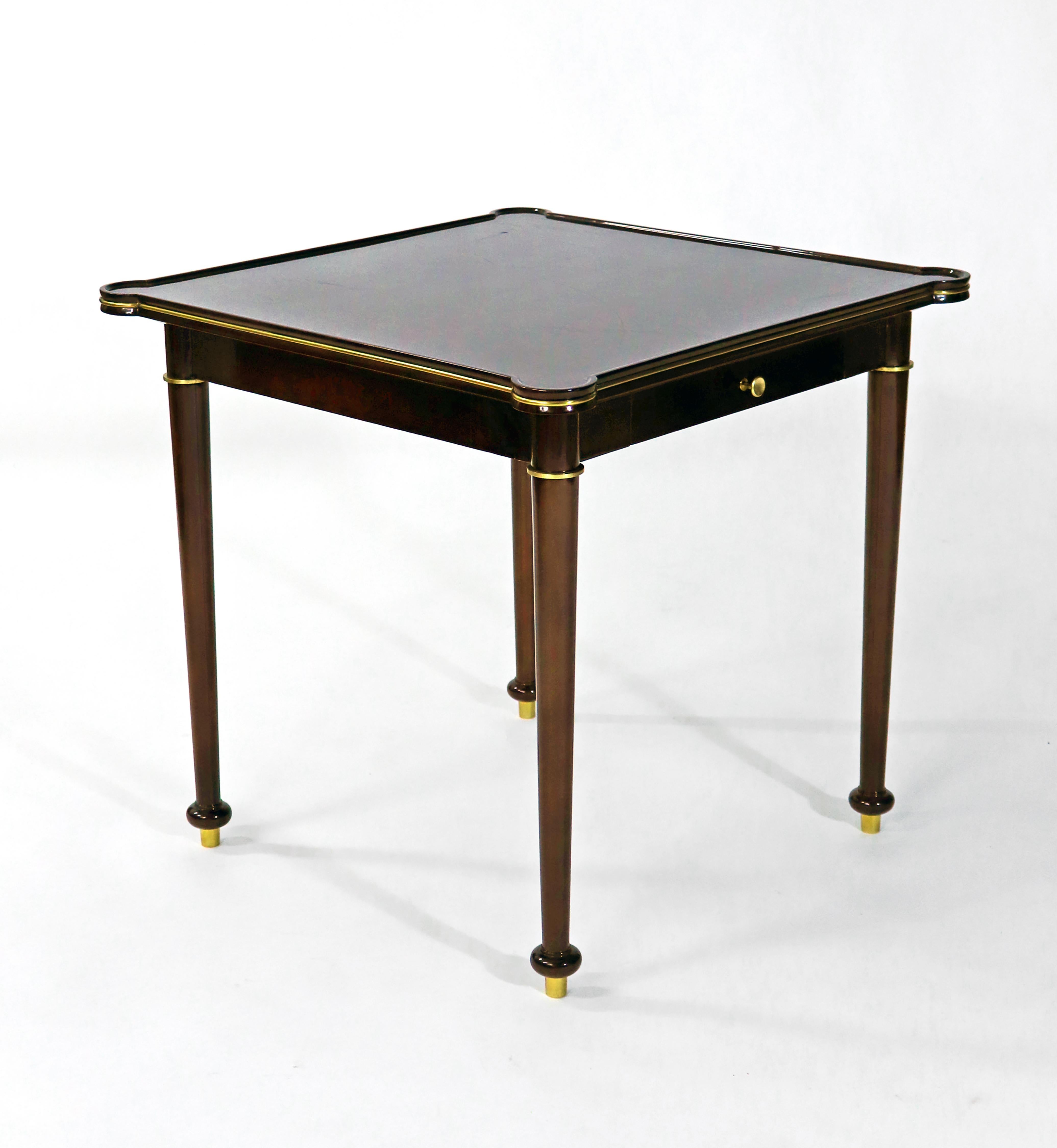 A game or card table in sycamore dark stained wood veneer upon a solid mahogany frame designed by Leleu, with four bridge chairs.
Made in France,
circa 1935
Signature: Leleu plaquette.