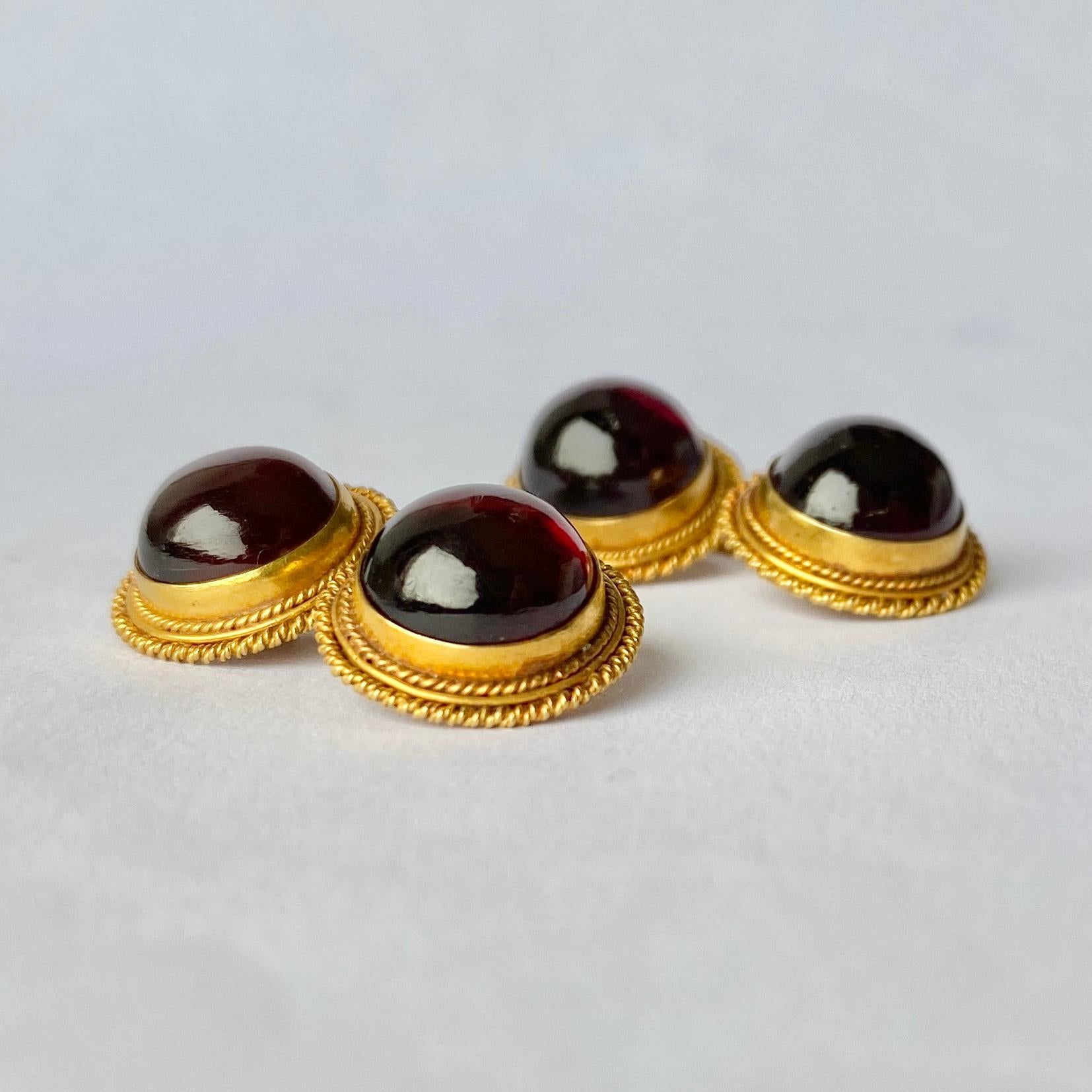 These gorgeous cufflinks hold a cabachon garnet which is surrounded by rope twist detail. They are modelled in 18ct yellow gold. 

Cufflink Diameter: 8mm

Weight: 8.3g
