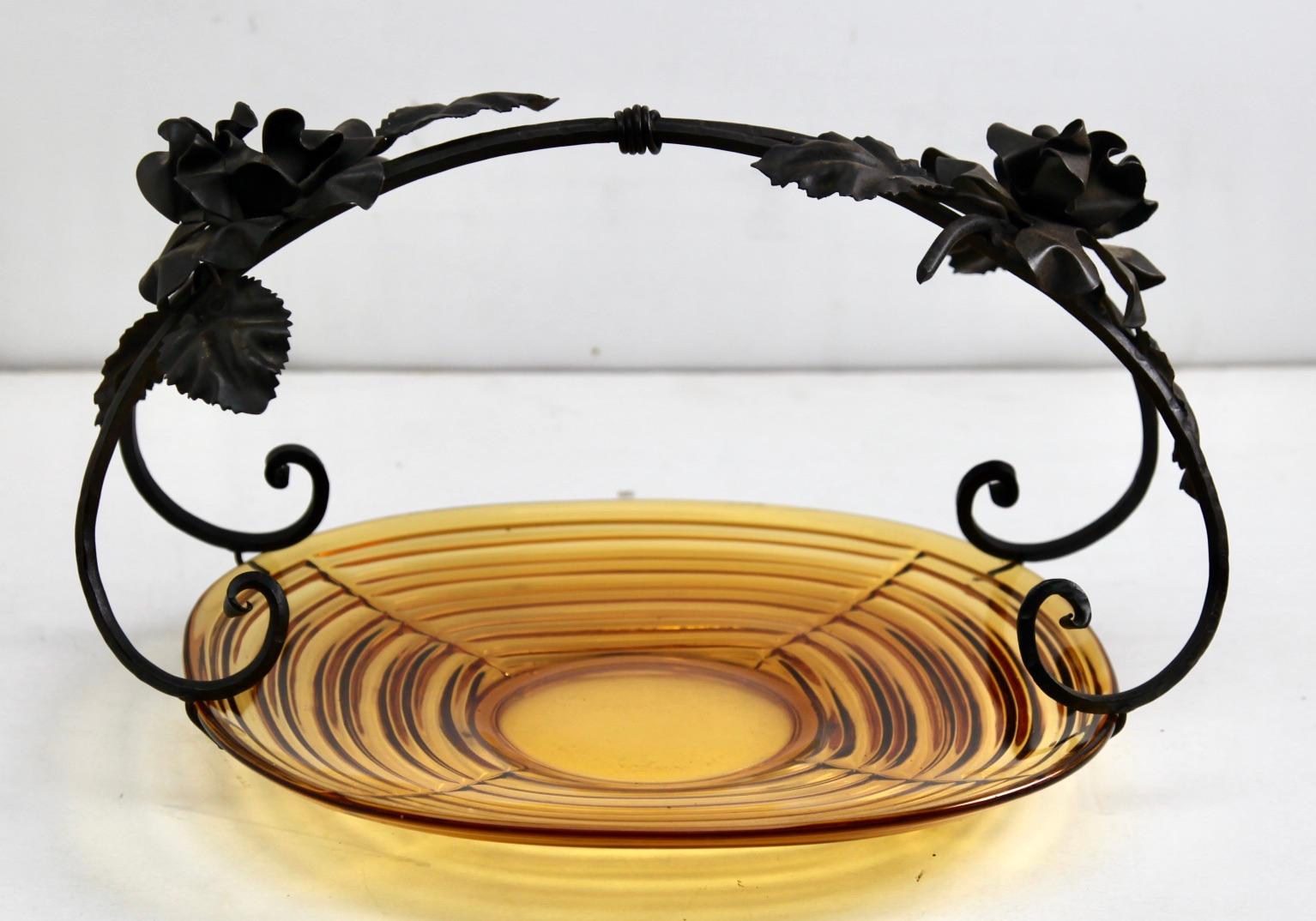 This unusual Belgian piece has the hallmarks of Belgian Art Deco and combines a glass gateau plate in a wrought iron carrier, The glass comes from an almost unknown factory, Pavillons de Beignee, who produced it between 1935 and 1940.
The recently