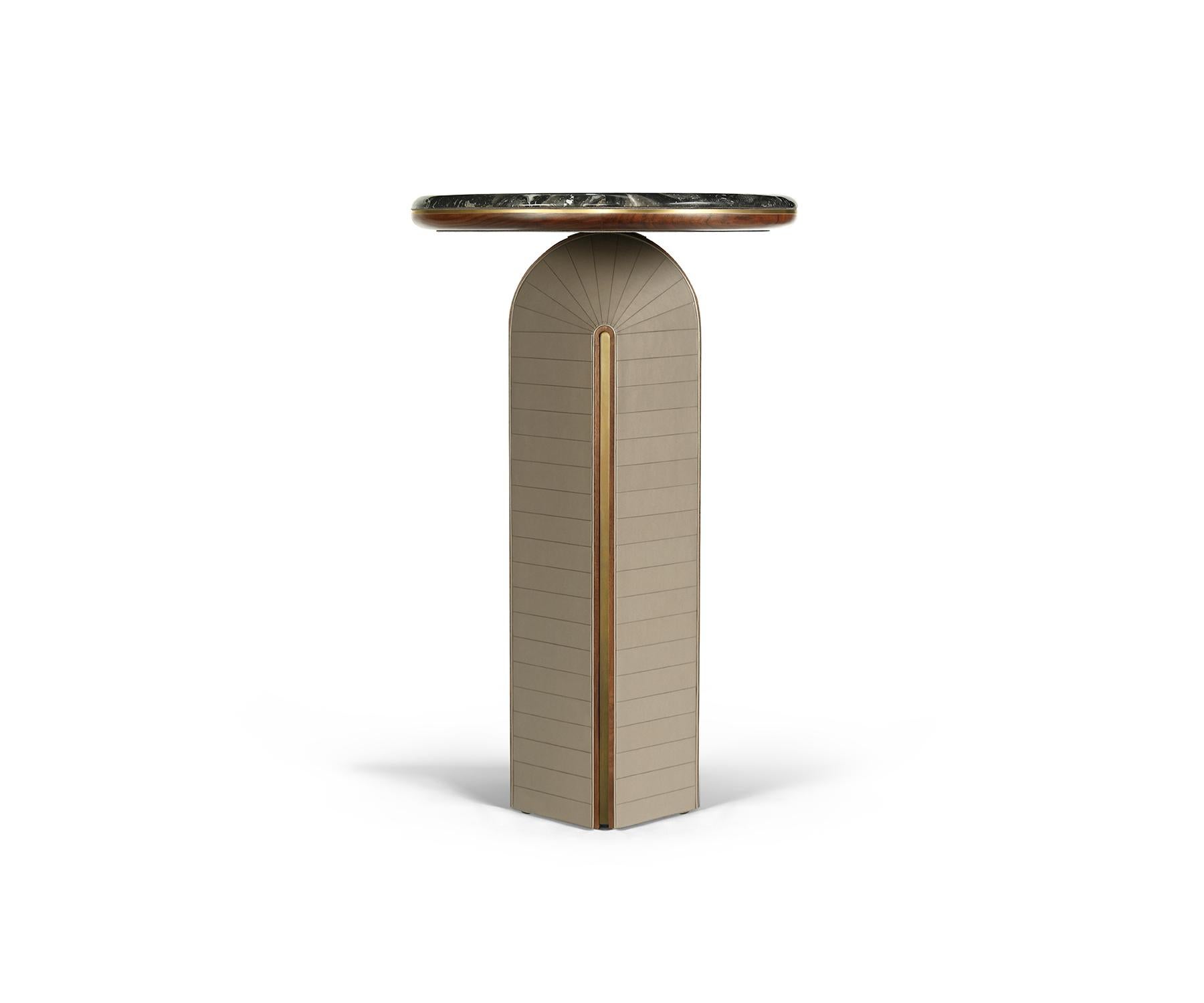 Inspired by the elegant geometry of 1940s Art Deco, the Geller console transforms this timeless aesthetic into a sleek and versatile design.

A Lustrous finish marble top, with natural veining anchors the design, stands elegantly on leather-wrapped