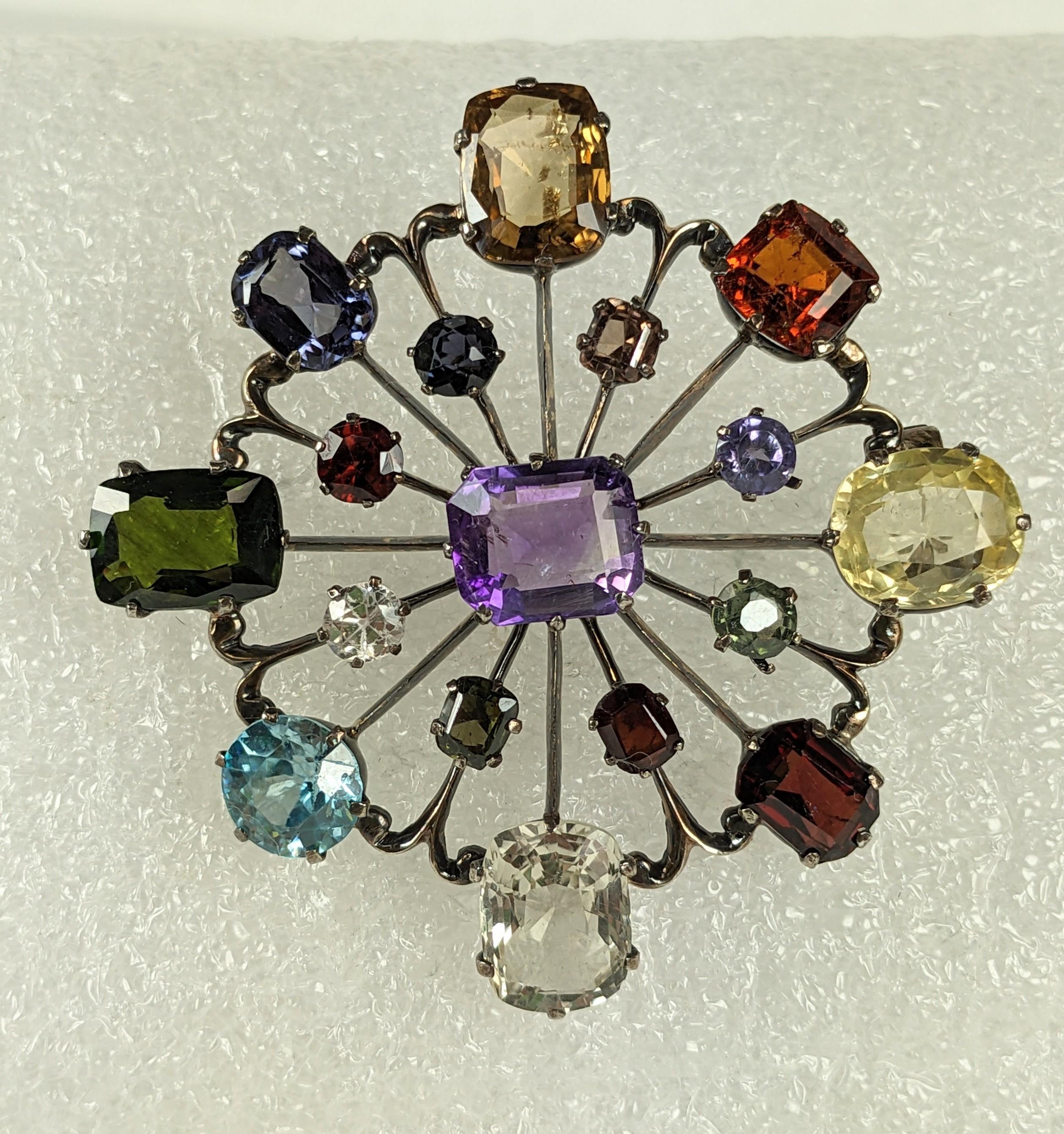 Art Deco Gem Stone Brooch from the 1940's. Set in pink gold vermeil sterling with a lovely array of colored gemstones such as citrine, topaz, zircon, amythest, tourmaline and garnet. 
2.25