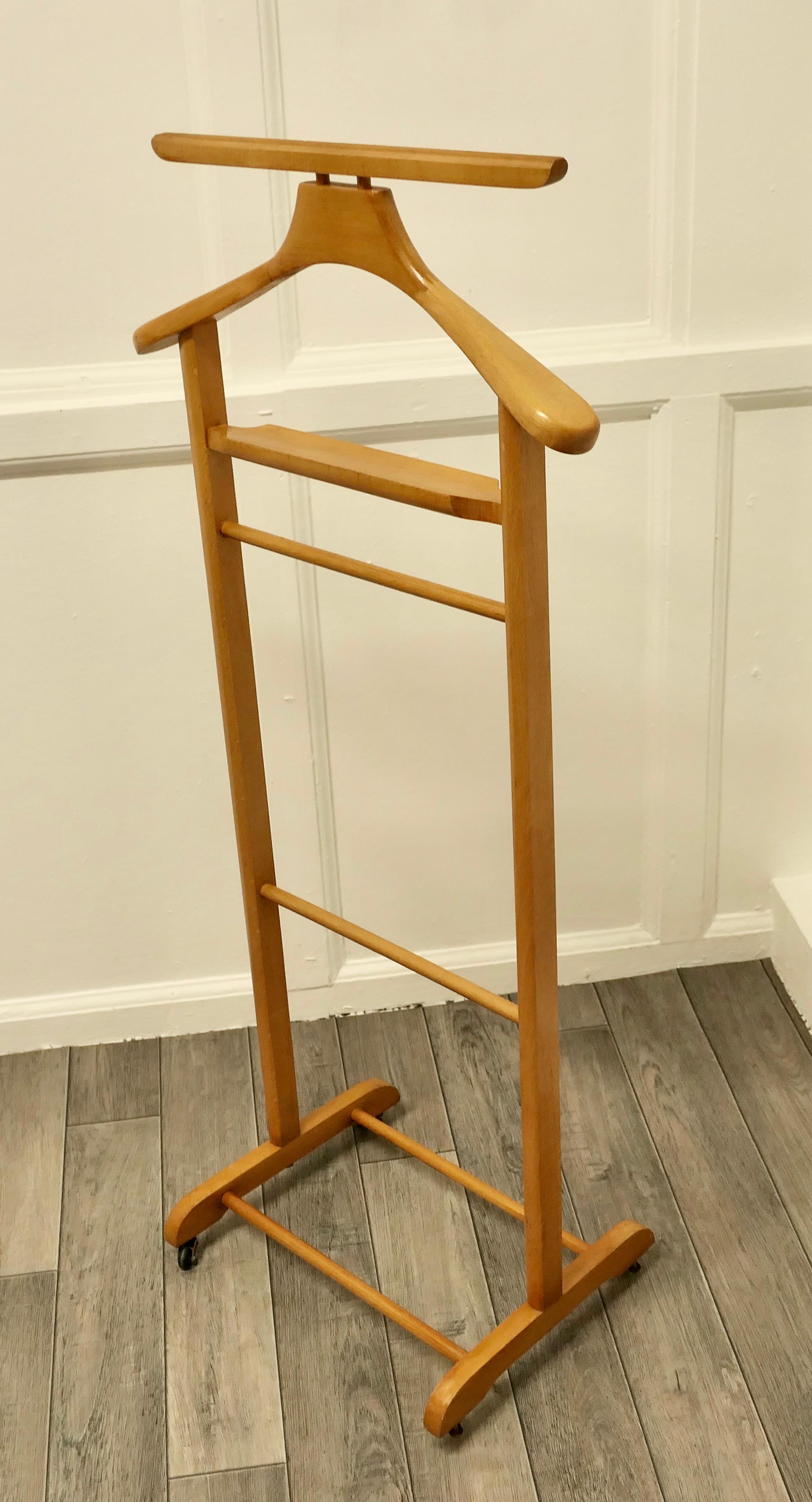 Art Deco Gentleman’s floor standing valet or suit hanger 

 A very useful piece, the Valet or clothes stand is made in beech, it will accommodate jacket and trousers, but it would do just as well for your jeans and a jacket overnight or would make