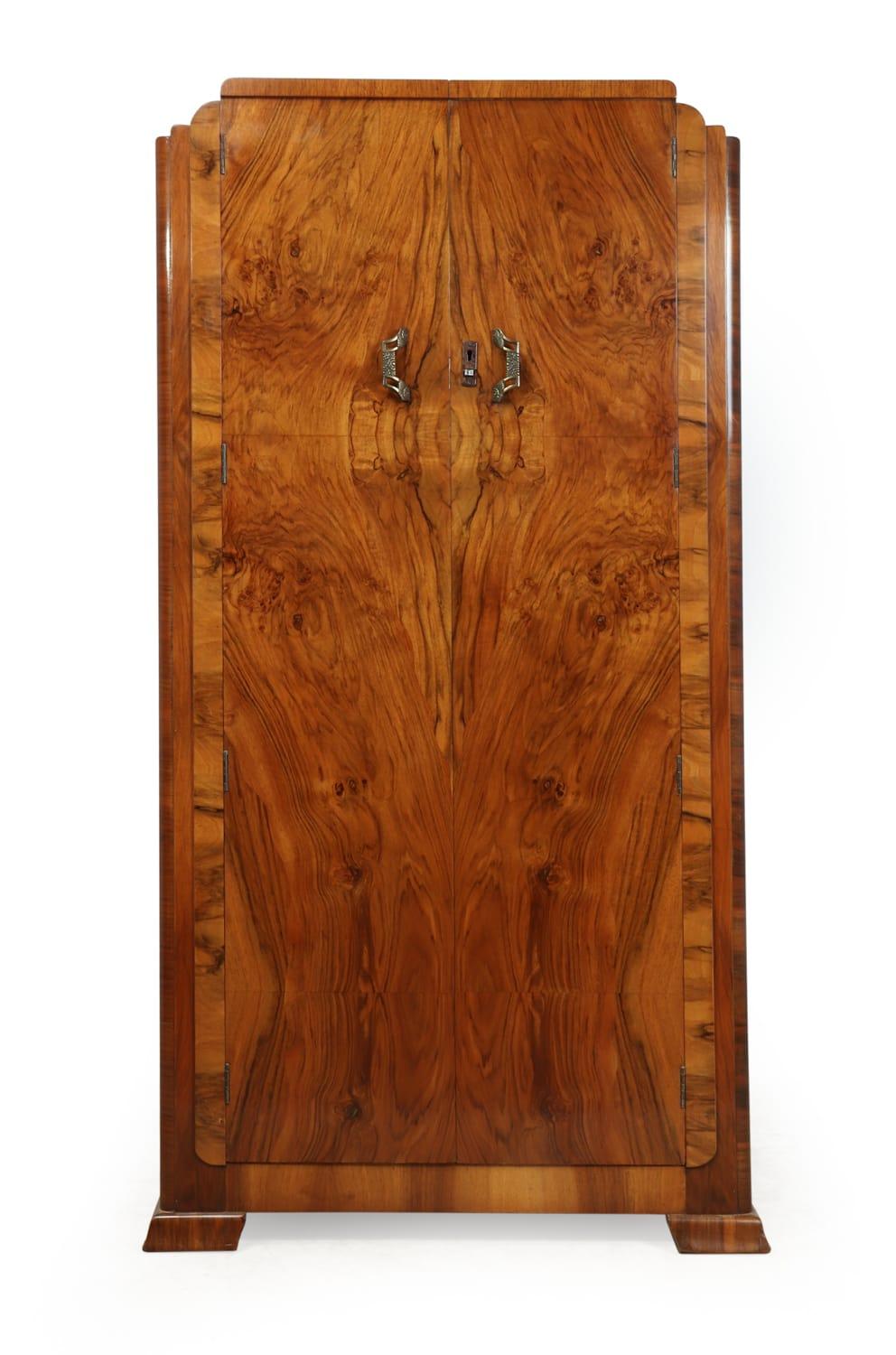 Art Deco gentleman's wardrobe
This Art Deco wardrobe has two figured walnut doors with a semi fitted interior the wardrobe is in very good condition and the exterior has been French polished

Age: 1930

Style: Art Deco

Material: