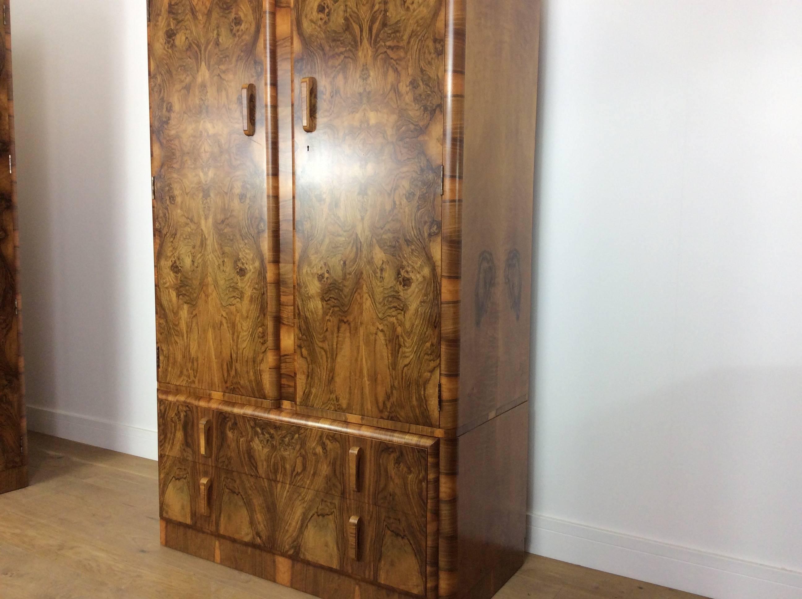 Art Deco gentleman's wardrobe with the most stunning figured walnut.
This really is the most stunning Art Deco tallboy, beautiful figured walnut veneer nice curved edges.
Nicely fitted out with compartments and hanging space, also two deep drawers