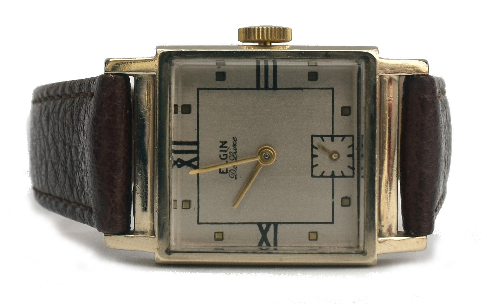 For your consideration is this very stylish gents 10k Gold filled manual wristwatch made by the American watchmakers Elgin, dates to 1946. Square case is 10k gold filled top and back in great condition. Silver dial is also very clean. Elgin 17 jewel