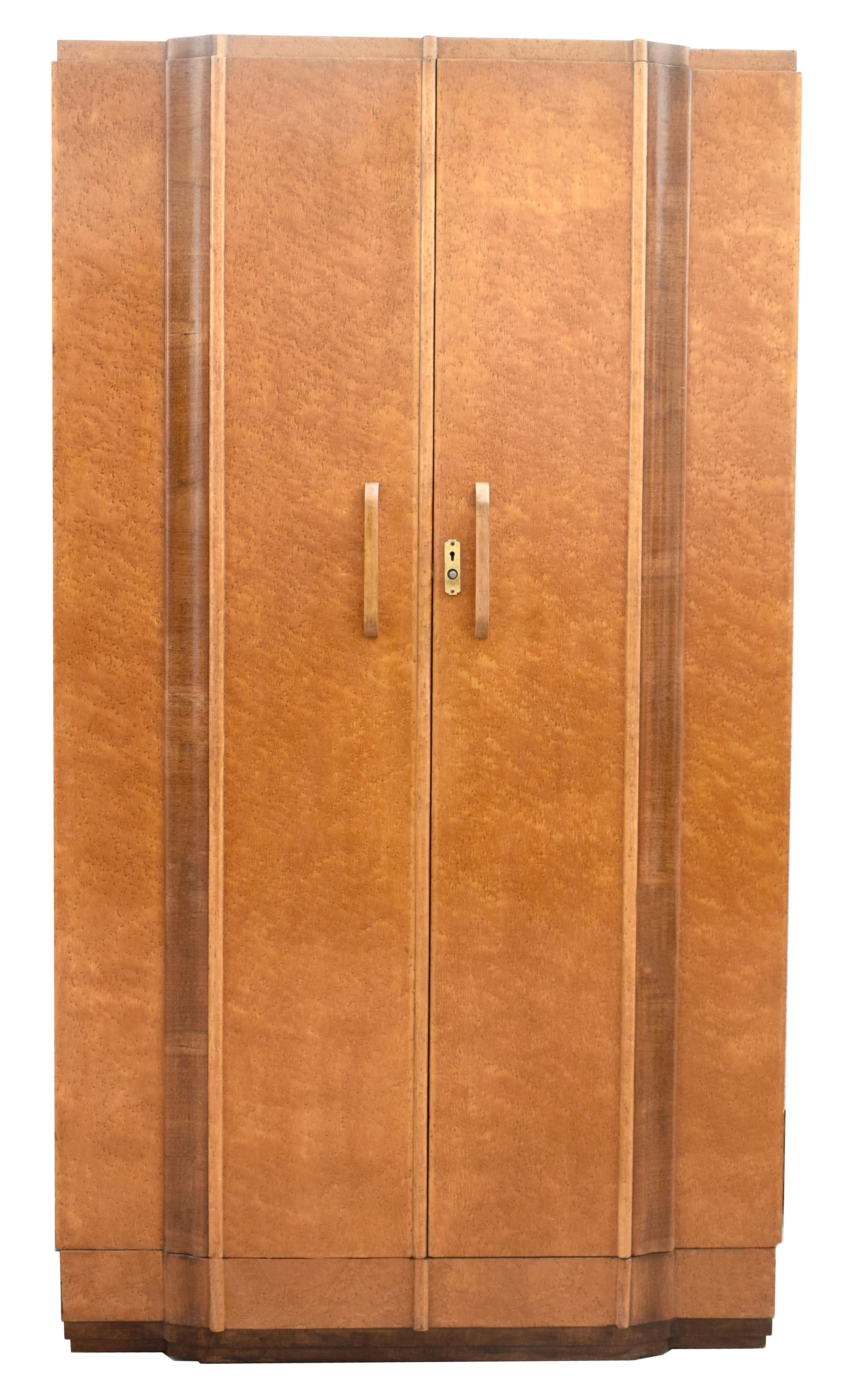 Superb and totally original is this 1930s Art Deco two-door maple wardrobe in a light blonde bird's-eye maple veneer. Not only does this wardrobe look impressive but it's extremely generous in the storage it provides. Offering three good sized cubed