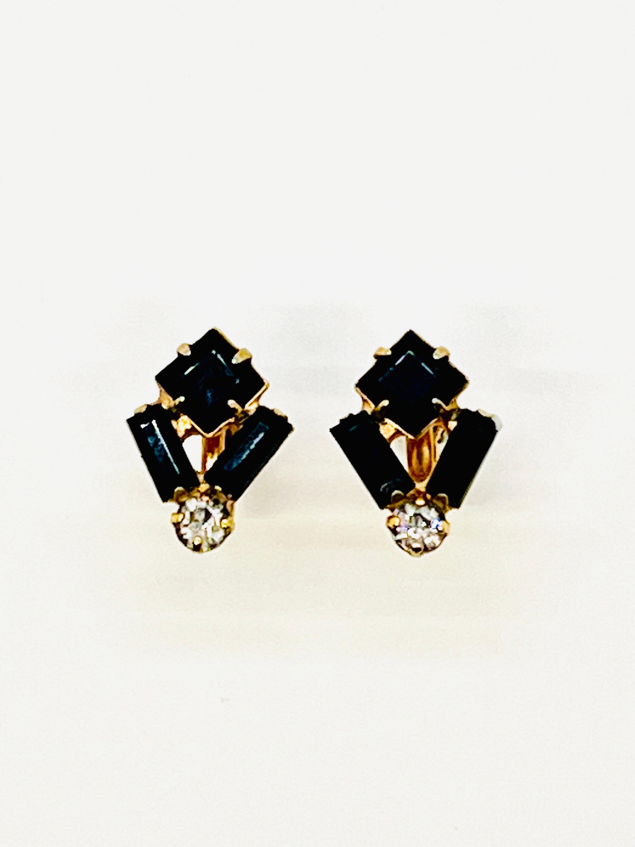 Tiny art deco, geometric baguette-cut and square-cut faux black emerald screwback earrings, puncuated with a brilliant cut crystal rhinestone. Lustrous gold brass. 

These dainty little earrings are so pretty. Understated and elegant, they would