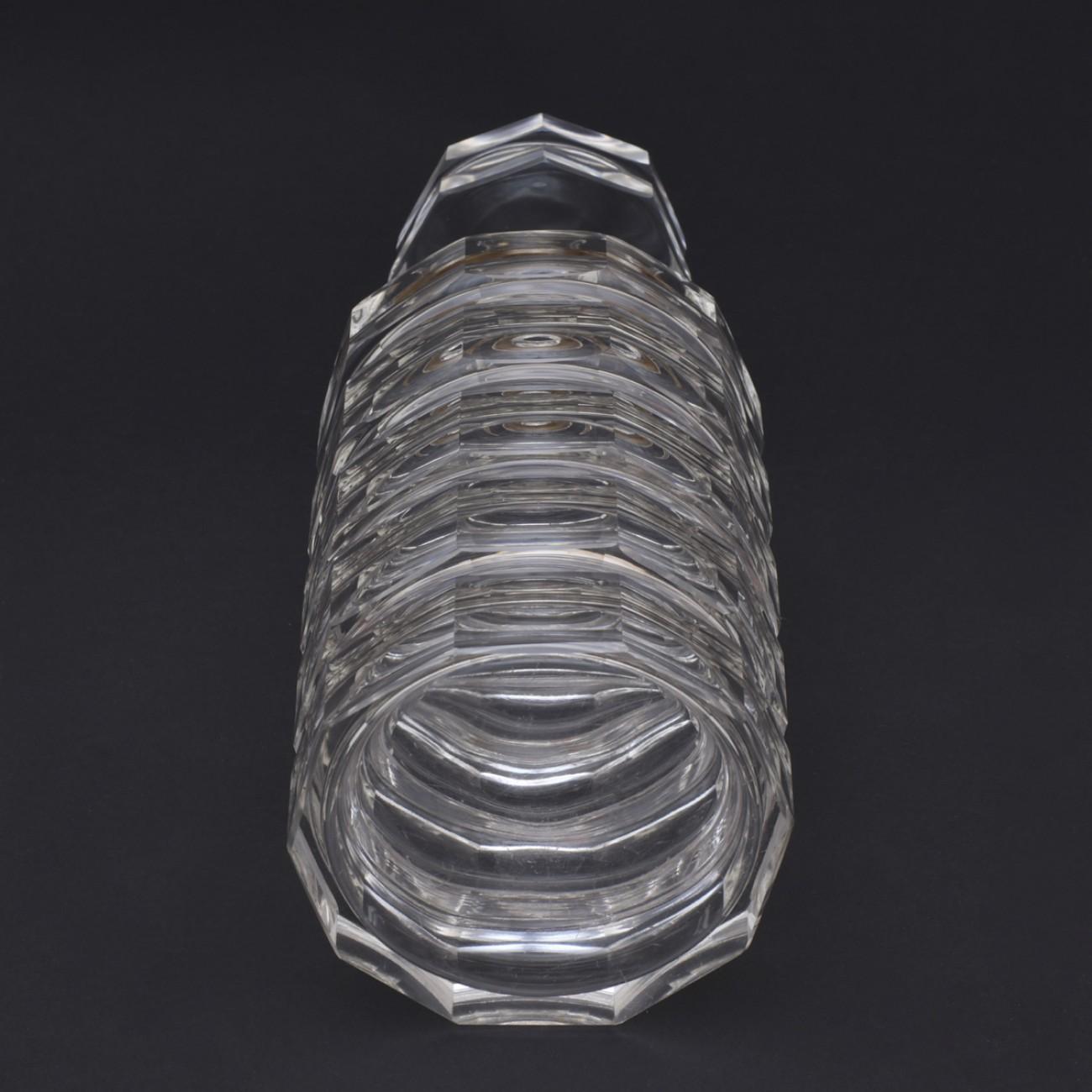 Stylish ten sided cut glass decanter with Sterling silver collar marked 900 and with makers mark for Simonet brothers of Belgium, circa 1935.
Well respected in their own right, the Simonet brothers produced work similar to Sabino and Lalique.