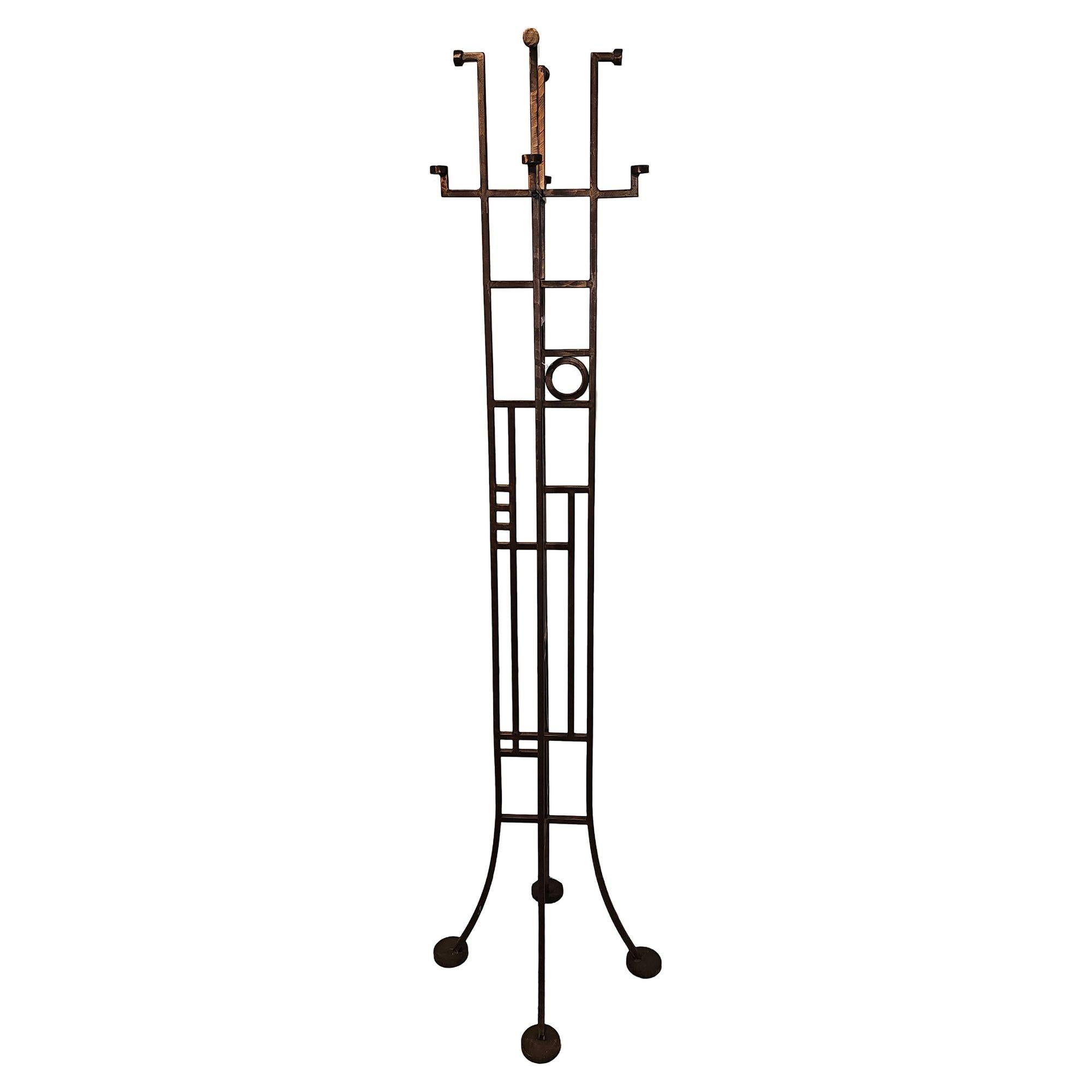 Neo Art Deco hall tree reminiscent of Frank Lloyd Wright, is executed in beautifully hand constructed in tubular steel finished in copper patina throughout. The body is fashioned after early Art Deco with geometric shapes throughout inside a