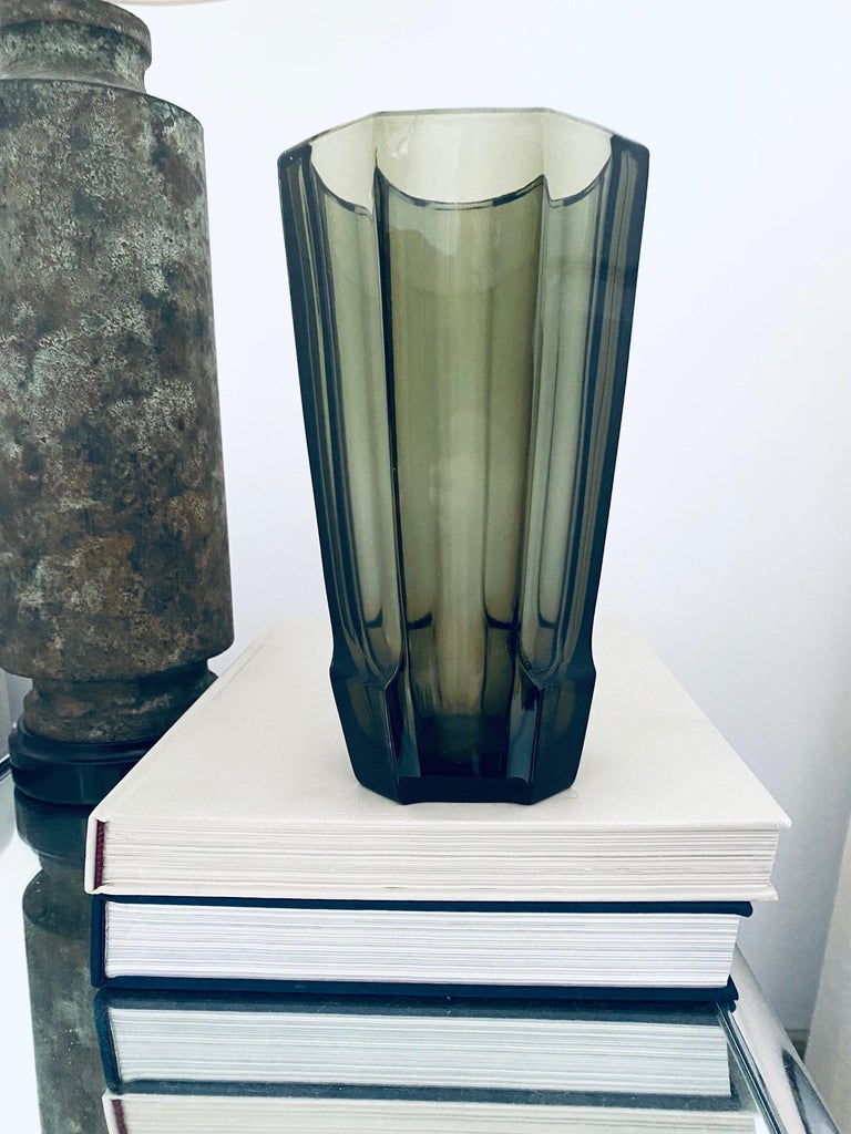 Vintage Czech Republic blown glass vase with Art Deco Machine Age Motif. Faceted art glass vase has octagon form with beveled and polished edges. Handcrafted in hues smoked grey or translucent black glass and features stylized geometric base.