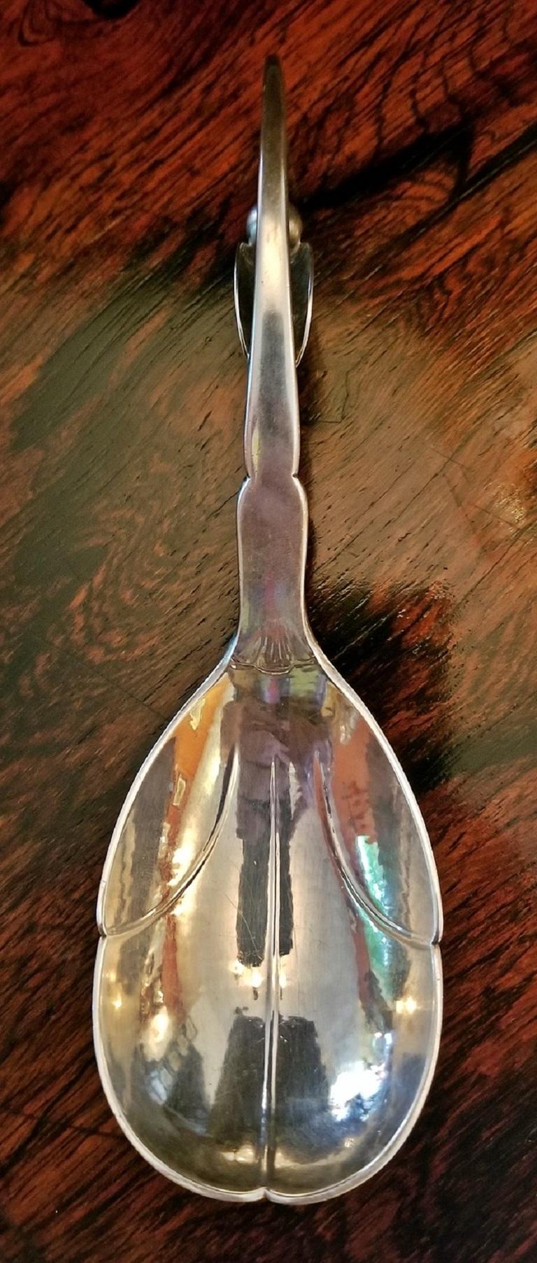 Beautifully cast sterling silver caddy spoon or sometimes referred to as a berry spoon, by the World Renowned Danish Silversmith….Georg Jensen.

Pattern No. 21…..but much larger than other similar pieces that have appeared for sale. Very Art Deco
