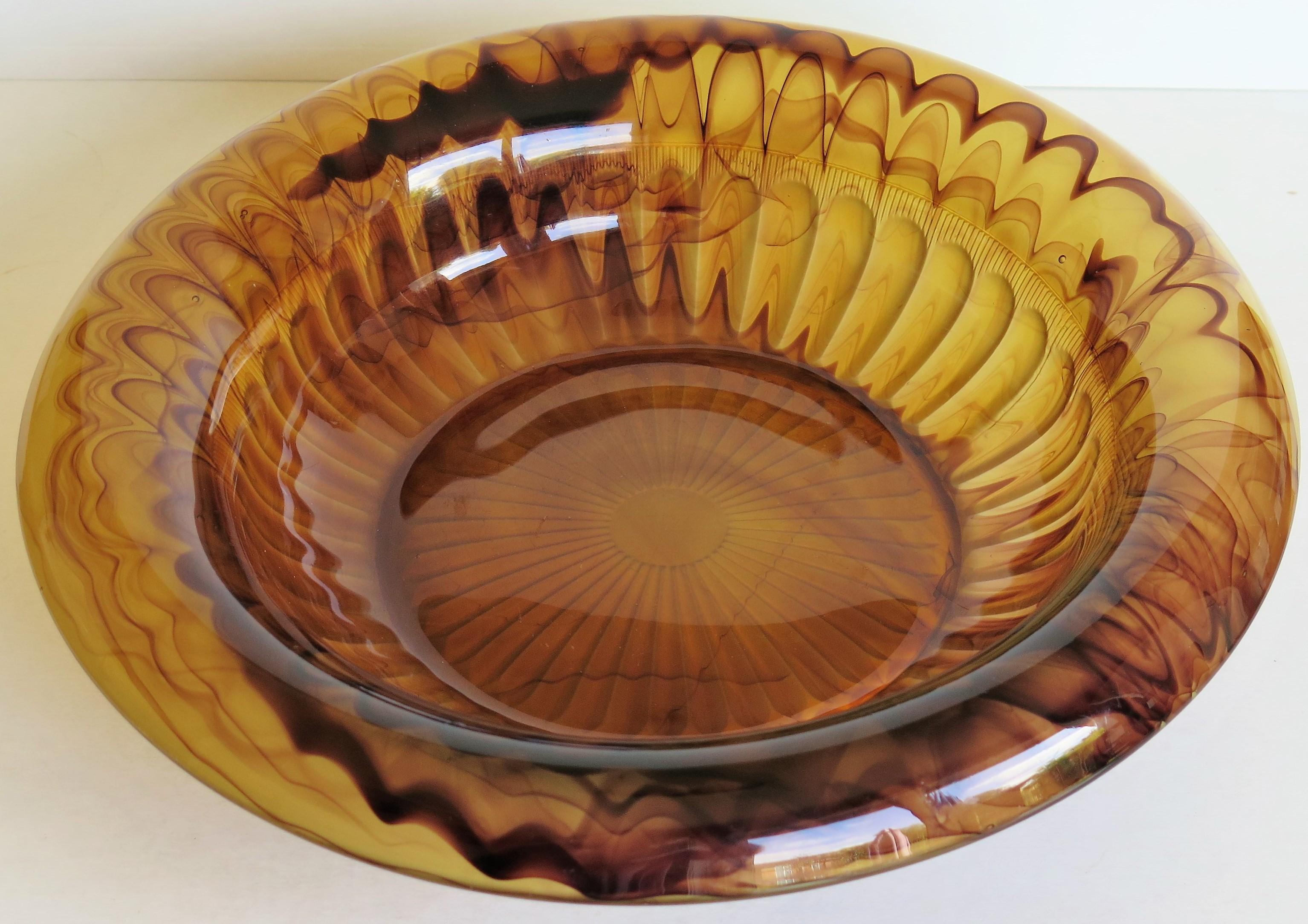 This is a beautiful large glass bowl made by George Davidson and Co. of Gateshead, England who started production of cloud glass in 1923.

This bowl has a roll-over rim and is shape or pattern 1910D as seen in their catalogues of 1931. The bowl