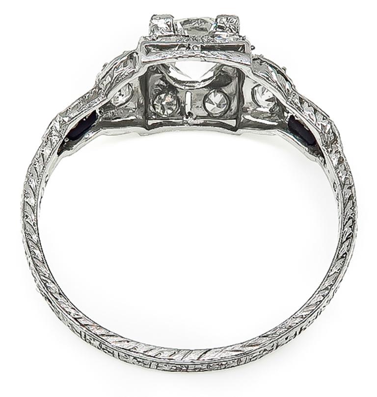 This elegant platinum engagement ring from the Art Deco era, is centered with a sparkling GIA certified old European cut diamond that weighs 1.00ct. graded H color with VS1 clarity. The center diamond is accentuated by high quality diamond accents