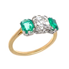 Art Deco GIA 1.52 Carat Diamond and Emerald Gold and Platinum Ring