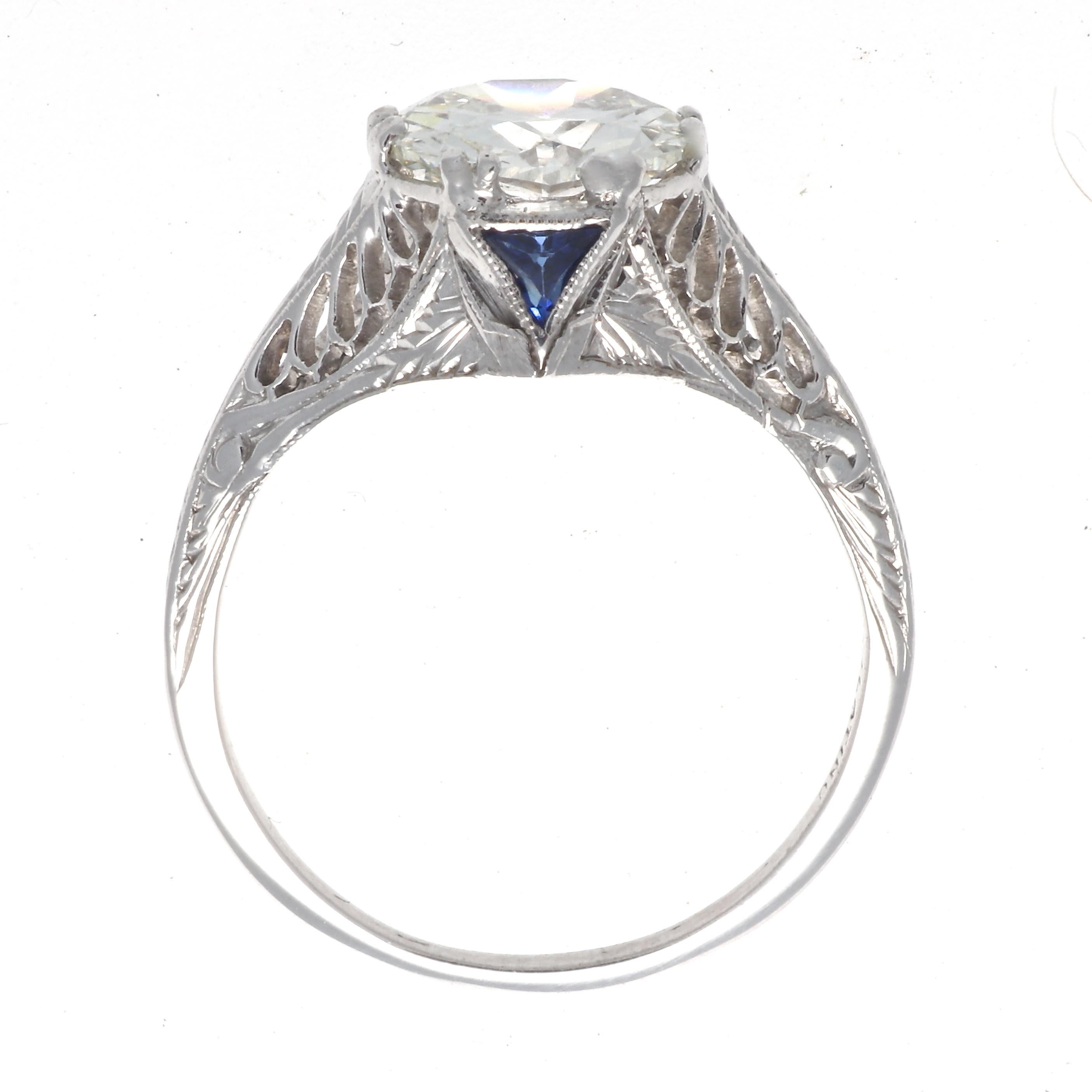 Art Deco platinum ring featuring a GIA 1.86 carat old European cut diamond, graded J color, VS2 clarity. With 2 French cut sapphires. Circa 1920s. Size 6 3/4 and comes with complimentary sizing if needed. 
Our 1stdibs Recognized Dealer/Platinum