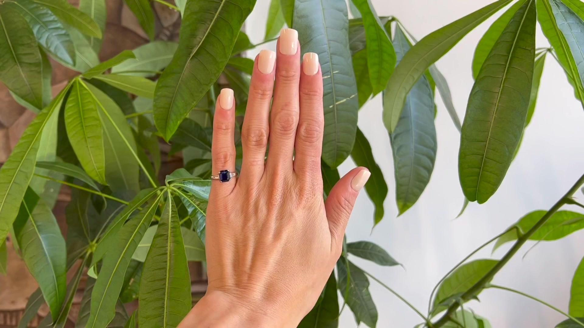 One Art Deco GIA 2.06 Carats Sri Lanka Sapphire Diamond Platinum Ring. Featuring one GIA octagonal step cut dark blue sapphire of 2.06 carats, accompanied with GIA #6227632794 stating the sapphire is of Sri Lanka origin. Accented by two baguette cut