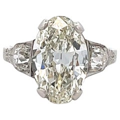 Antique Art Deco GIA 3.00 Carats Oval Cut Diamond Platinum Three Stone Ring