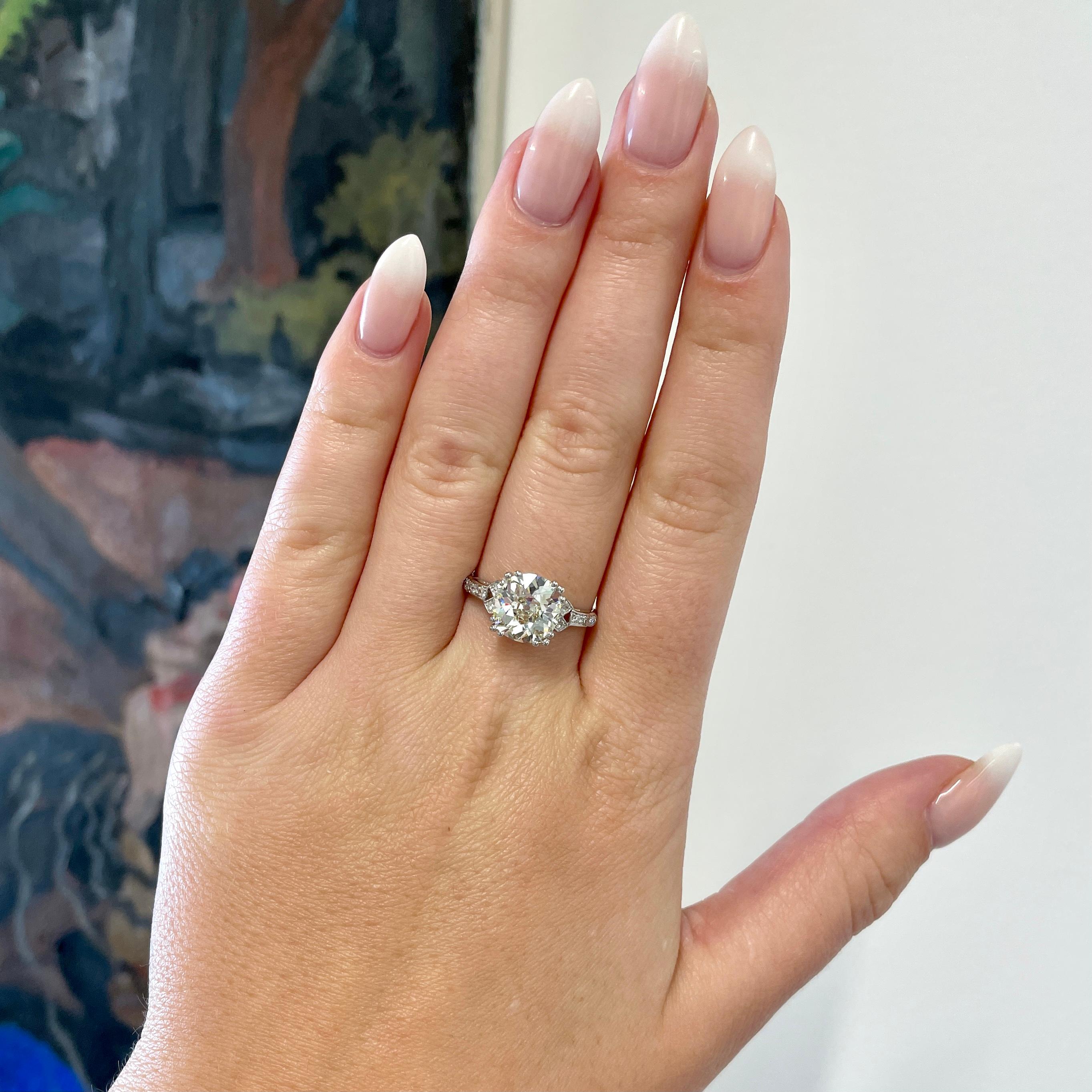 Are you looking for the perfect antique engagement ring? Consider this intricate Art Deco GIA 3.11 carat Cushion Cut Diamond Platinum Engagement Ring. Vibrant, bright and full of life. 

The center stone is GIA certified 3.11 carat antique cushion