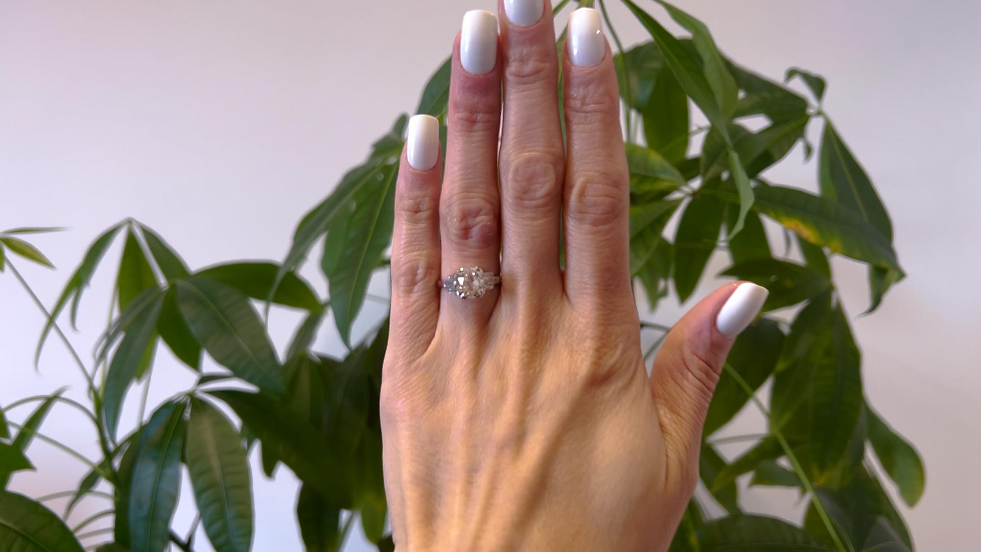 One Art Deco GIA 3.18 Carat Old Mine Cut Diamond Platinum Ring. Featuring one GIA old mine cut diamond of 3.18 carats, accompanied with GIA #5232019058 stating the diamond is N color, VS1 clarity. Accented by six baguette cut diamonds with a total