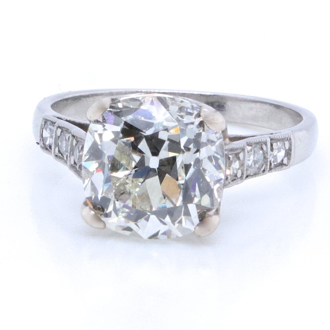 The ultimate antique engagement ring. The perfect diamond, setting and the stunning band, all make a dream ring. No matter where you go, this ring is definitely eye-catching. Art Deco GIA certified 4.02 carat antique cushion cut, K color, VS1