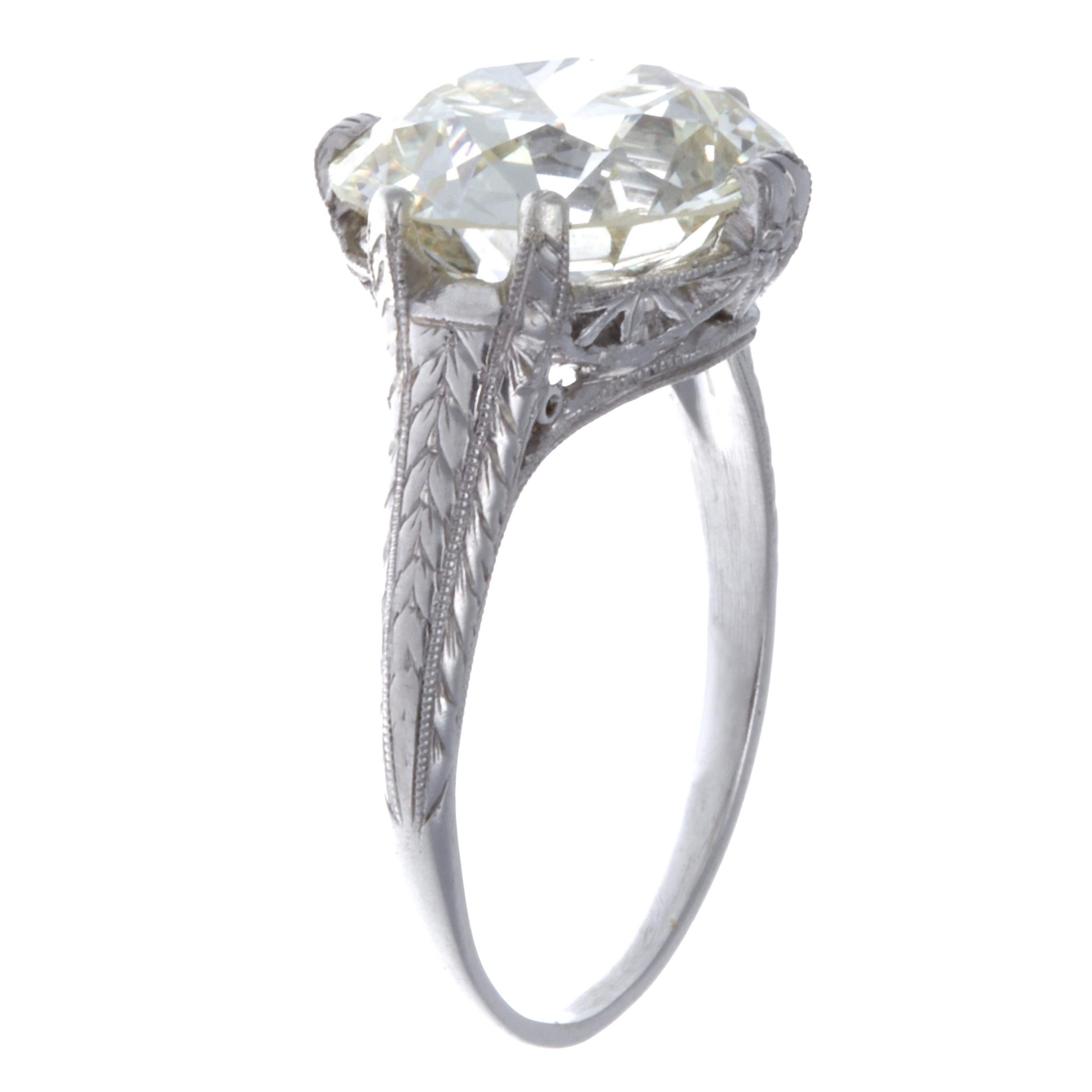 If diamond size is important for you, this Art Deco platinum diamond engagement ring offers the highest value for a reasonable price. The striking diamond is highlighted by the use of minimal prongs, and the stunning thin Art Deco filigree band