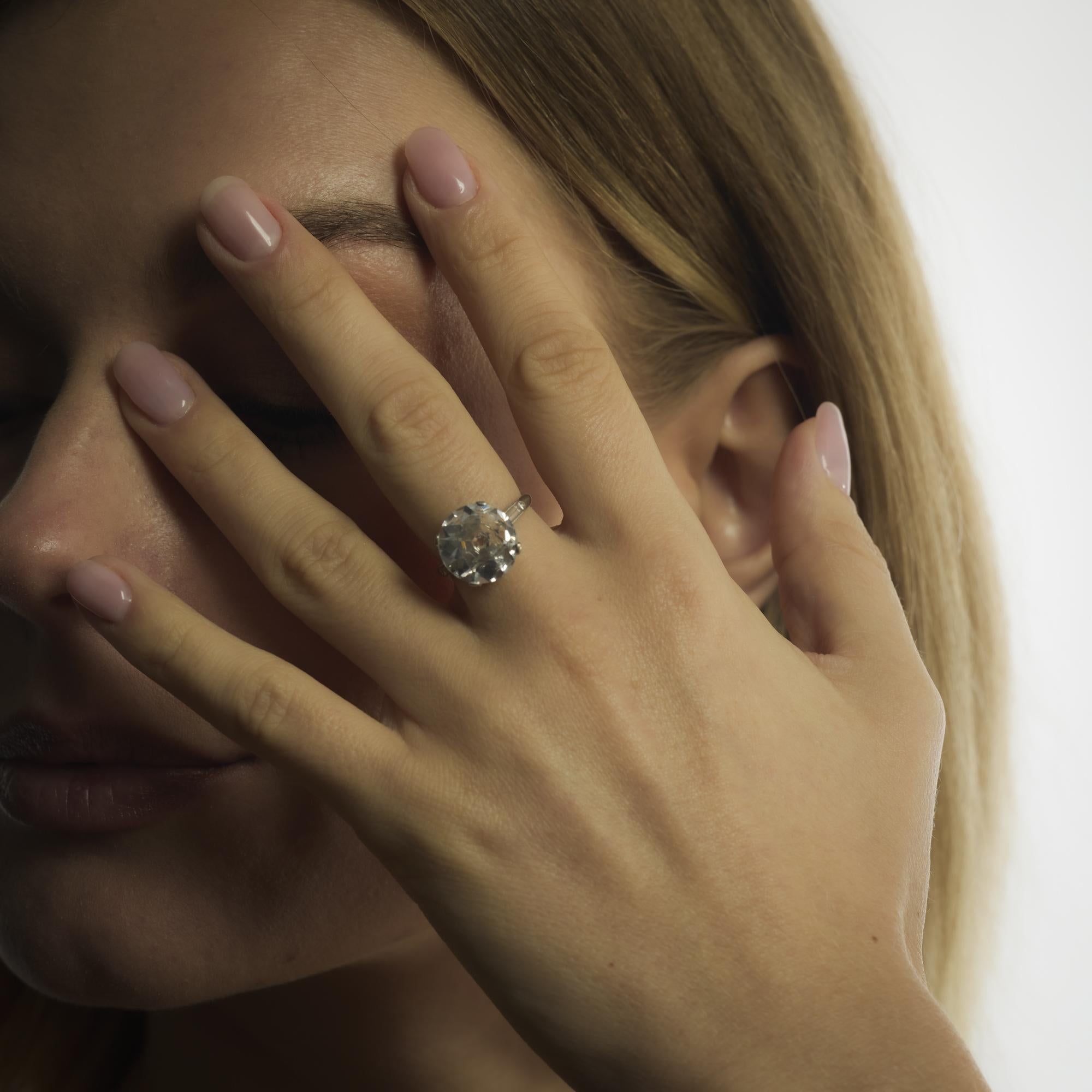 This Art Deco platinum ring features a magnificent 4.60 carat old European cut diamond, E color and VS1 clarity, flanked by baguette diamonds for timeless sophistication.