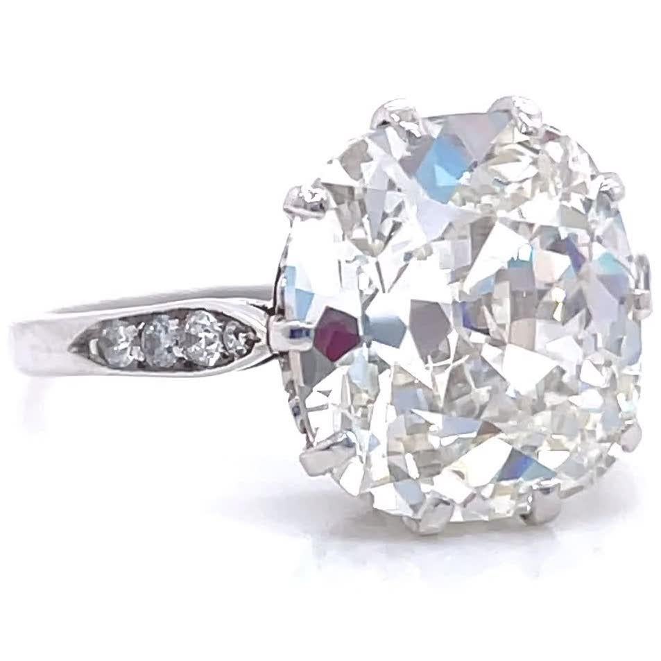 Everyone is on the hunt for these diamonds. Large carat antique cushion cut diamonds are extremely hard to find these days. We found one of the most beautiful; a GIA certified 5.02 carat, K color, SI1 clarity, (#6214181861). Accented by eight single