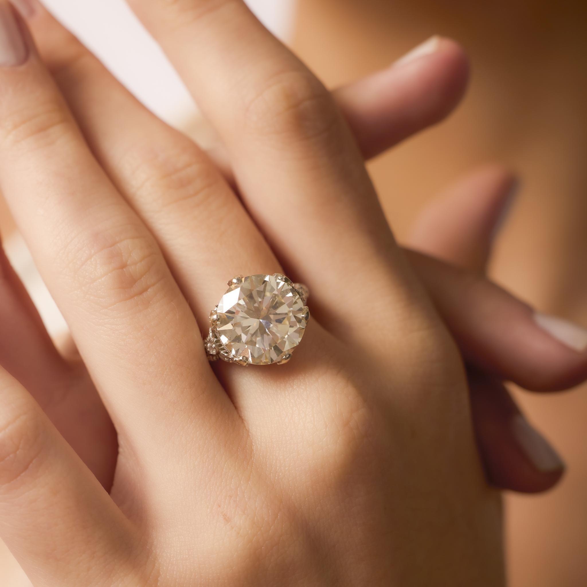 This Art Deco platinum ring features an 8.84ct GIA-certified round brilliant diamond, accented by 28 single cut diamonds in a refined 1930s geometric setting.