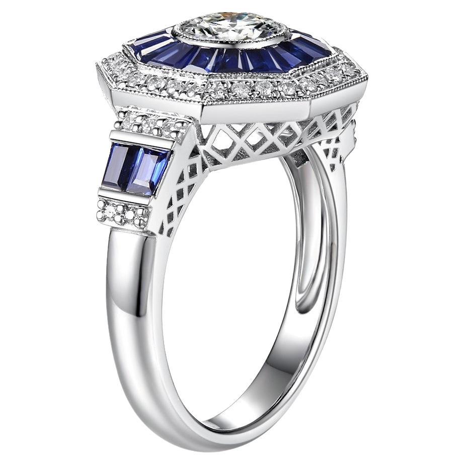 This ring features a GIA certified diamond weight 0.70 carat, K color, VS 2 clarity at the center. Assented with 1.61 carat of natural sapphire halo set in platinum. The sapphire are surrounded by smaller diamonds weight 0.23 carat. This ring is