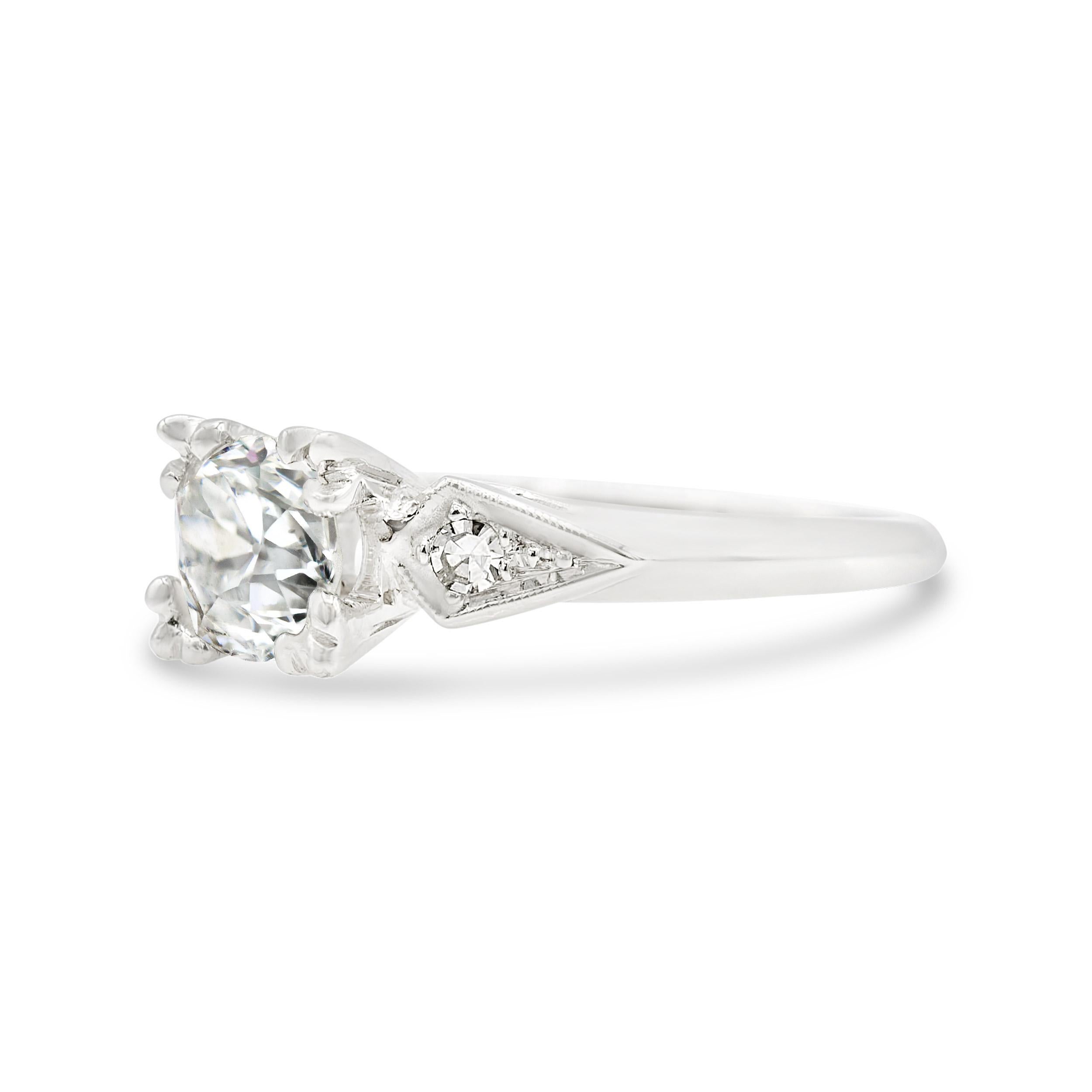 Mirror mirror on the wall, this snow-white Deco engagement ring is the fairest of them all! At its center is an exceptionally bright GIA-certified E color diamond that radiates from a fishtail prong setting. Flanked by sparkly arrow-shaped diamond