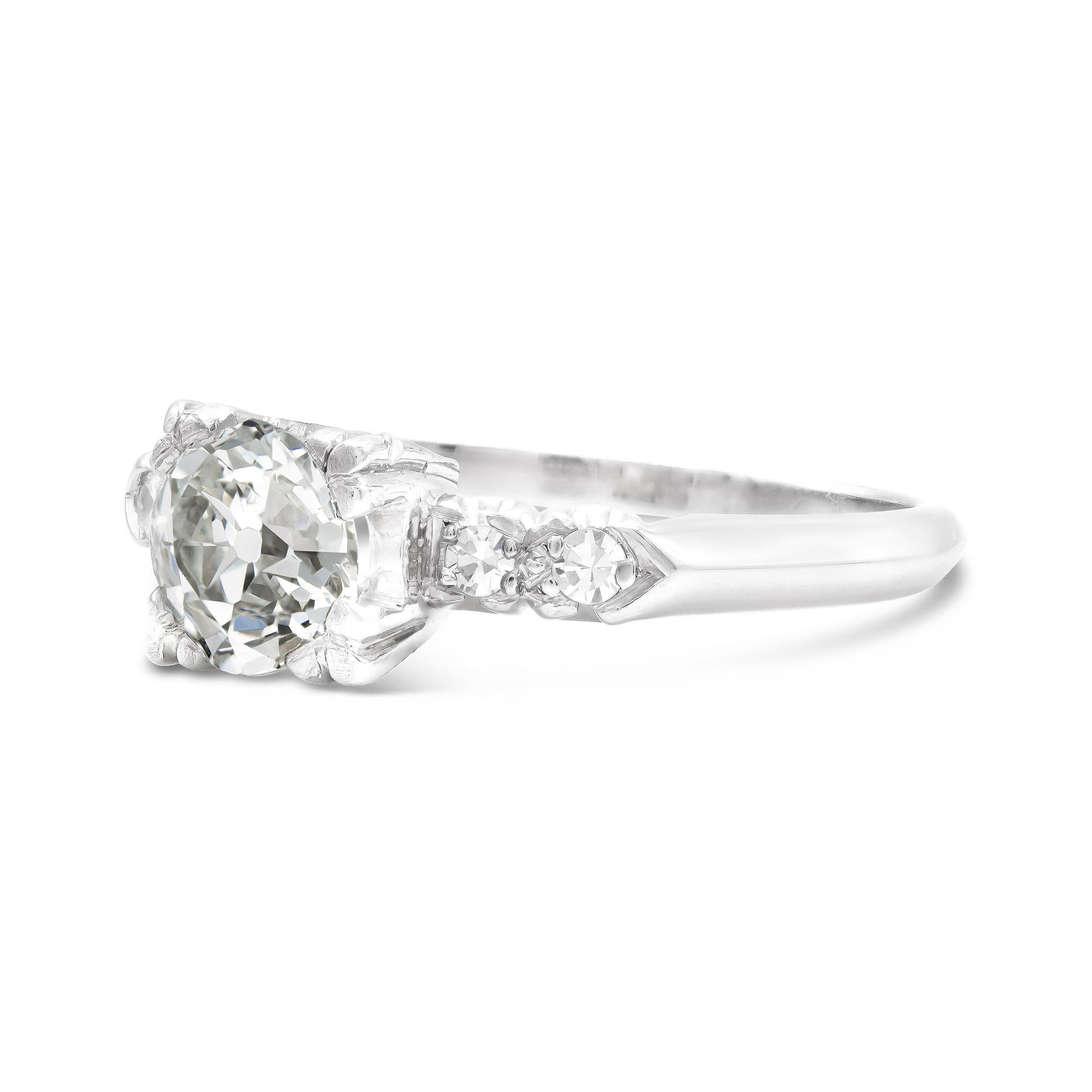 This is as classic as it gets for an Art Deco engagement ring design. We have a GIA graded old European cut diamond weighing nearly a full carat and captivating us with its mesmerizing sparkle. Complete by shouldering single cuts and a knifes-edge