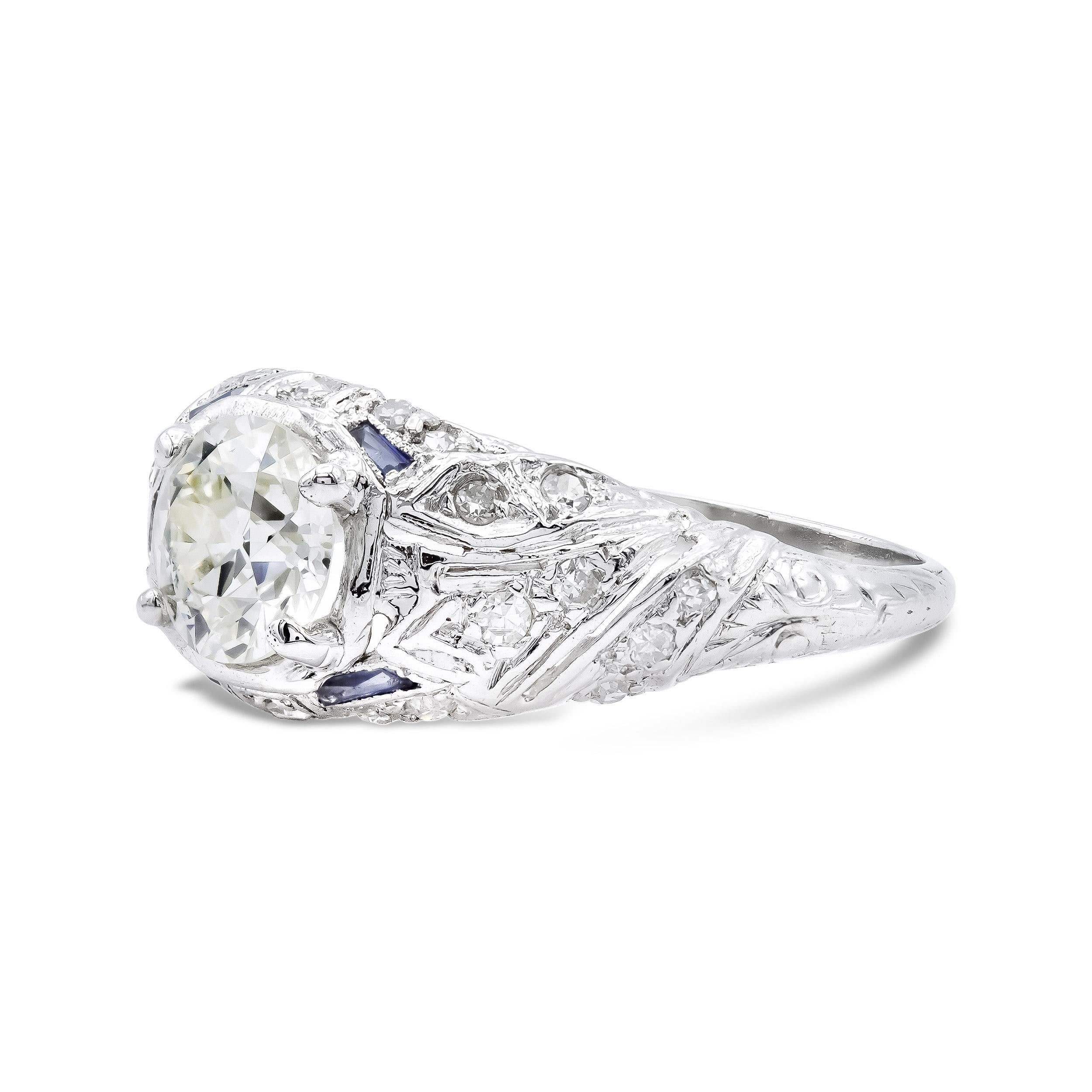 The swooping filigree design adorning this ring has us in a trance. Centering the deco-era design is a 1.02 carat old European with a distinct facet pattern and so much spread. It practically floats above the ring, enhanced by droplets of