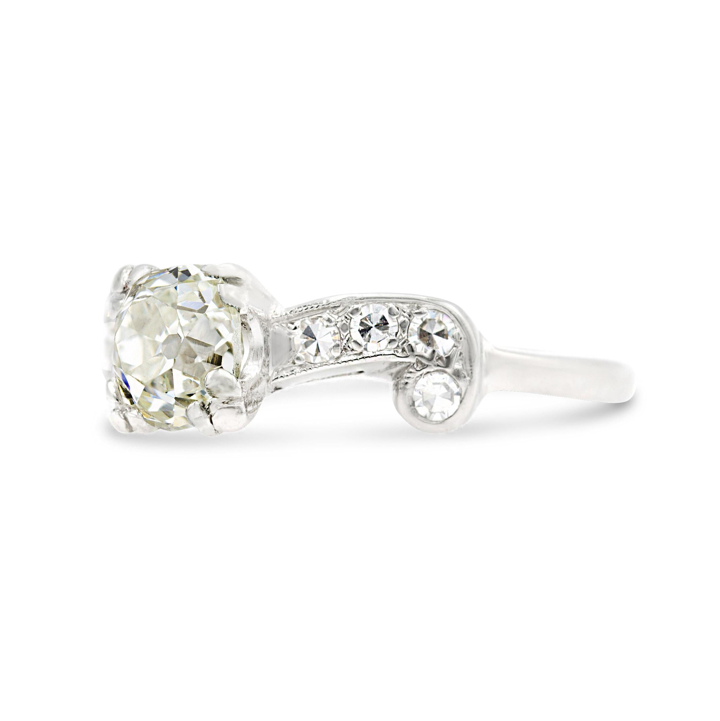 Slip this dazzling diamond engagement ring on your finger and put on the glitz. Taking center stage is a bright and colorless 1.13 carat rectangular old mine diamond. The distinguished center stone is complemented by 8 single cut diamonds twinkling