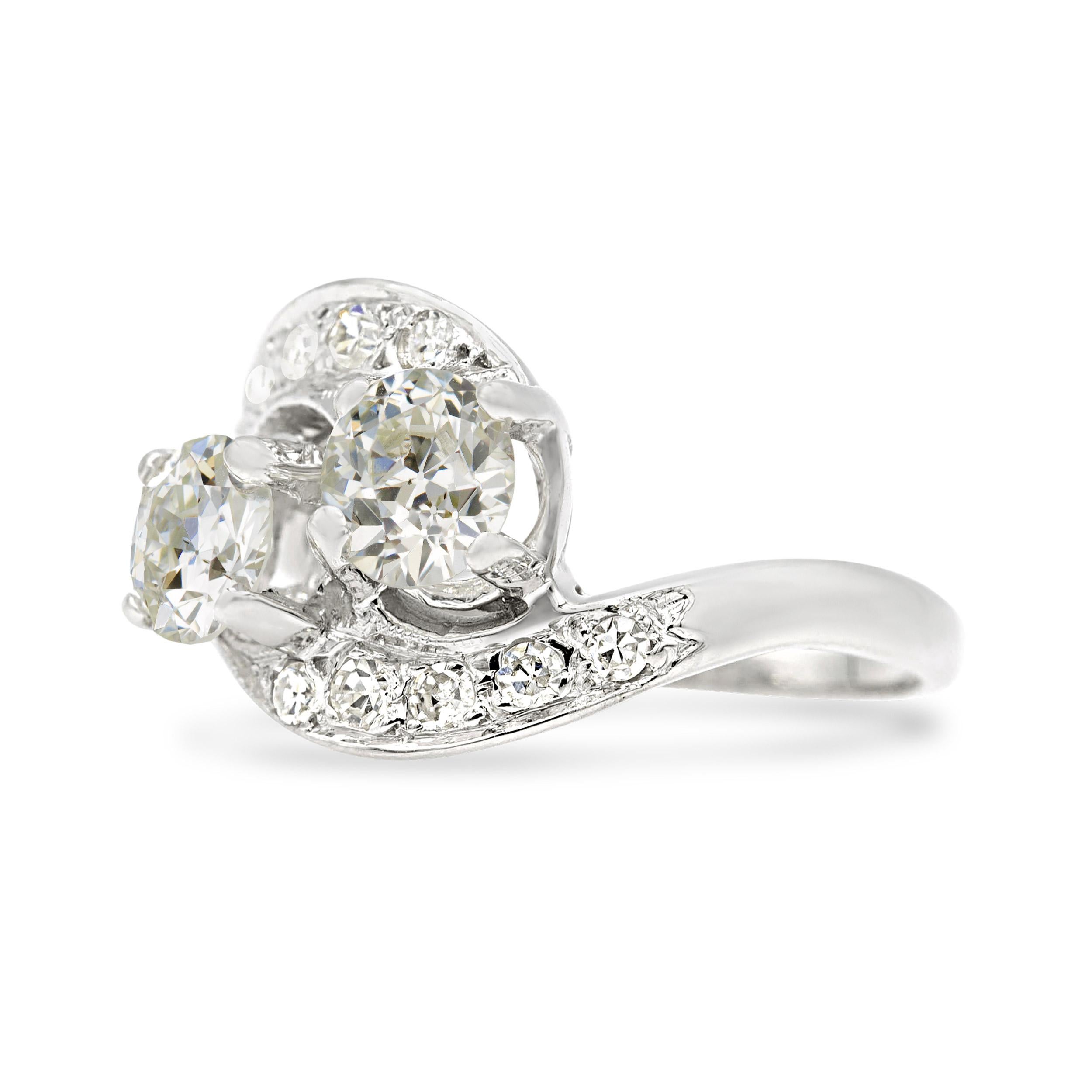 Two sparkling old European diamonds are the stars of this romantic deco ring. Graded K and J color by GIA, these charming Euro’s face much whiter, and absolutely sparkle with brilliance. The toi et moi setting is perfectly suited for this matching