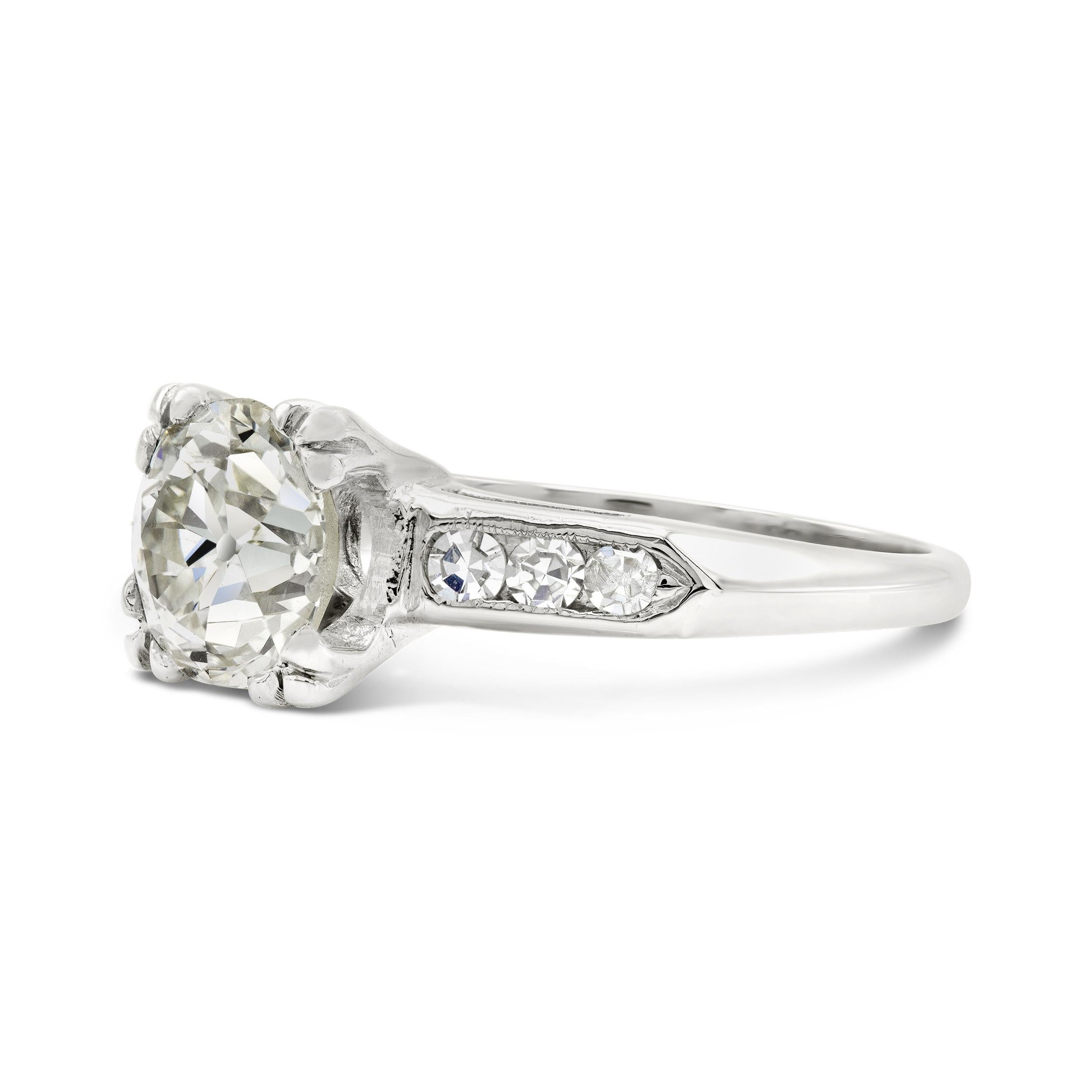 There is nothing more quintessentially deco than this engagement ring setting. A perfectly plump old European cut diamond steals the show, boasting an open culet and glistening facets. We are entranced by it's prismatic sparkle and equally lively